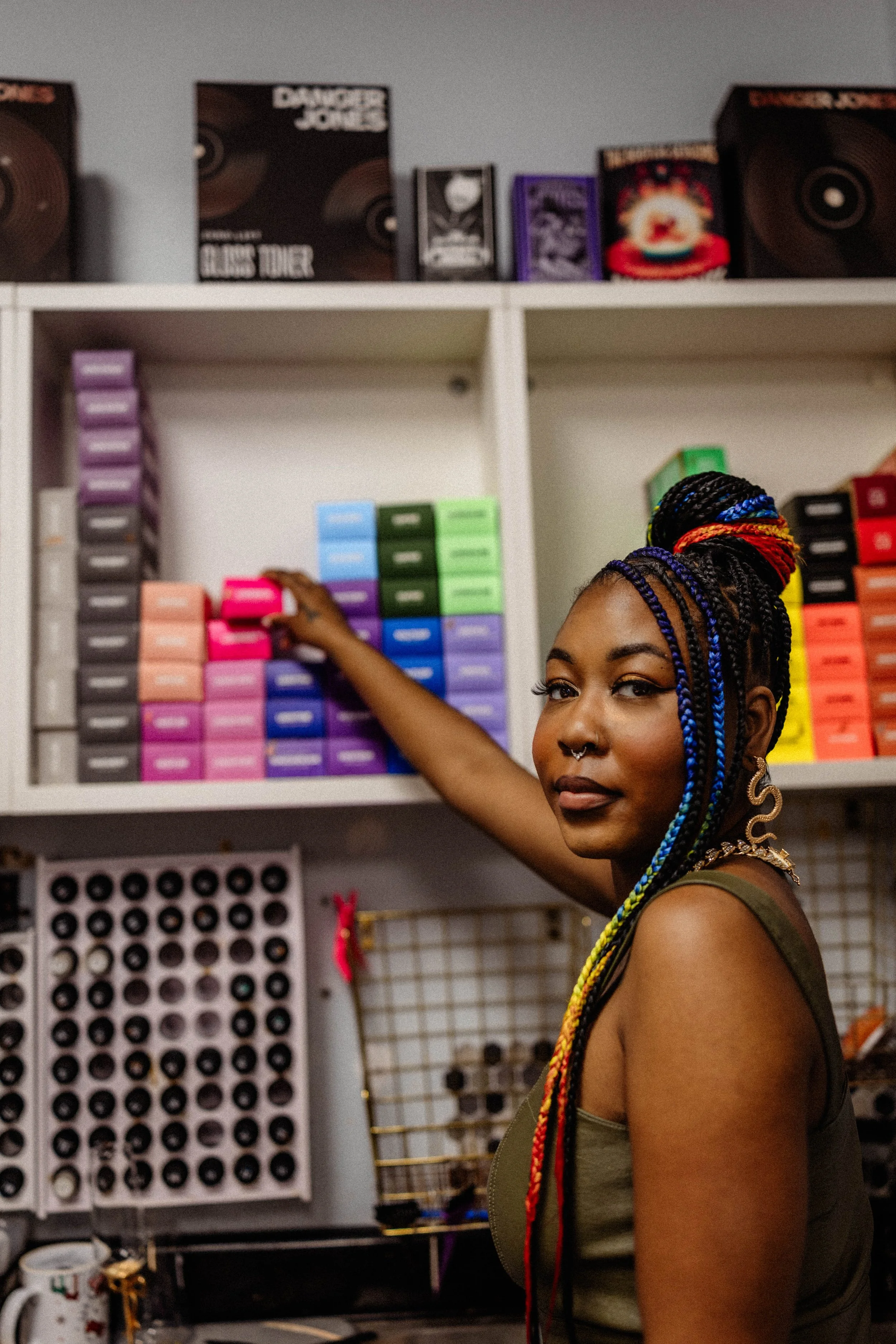 Stylist selecting custom hair color at Alfa Jae Salon in Cary, NC