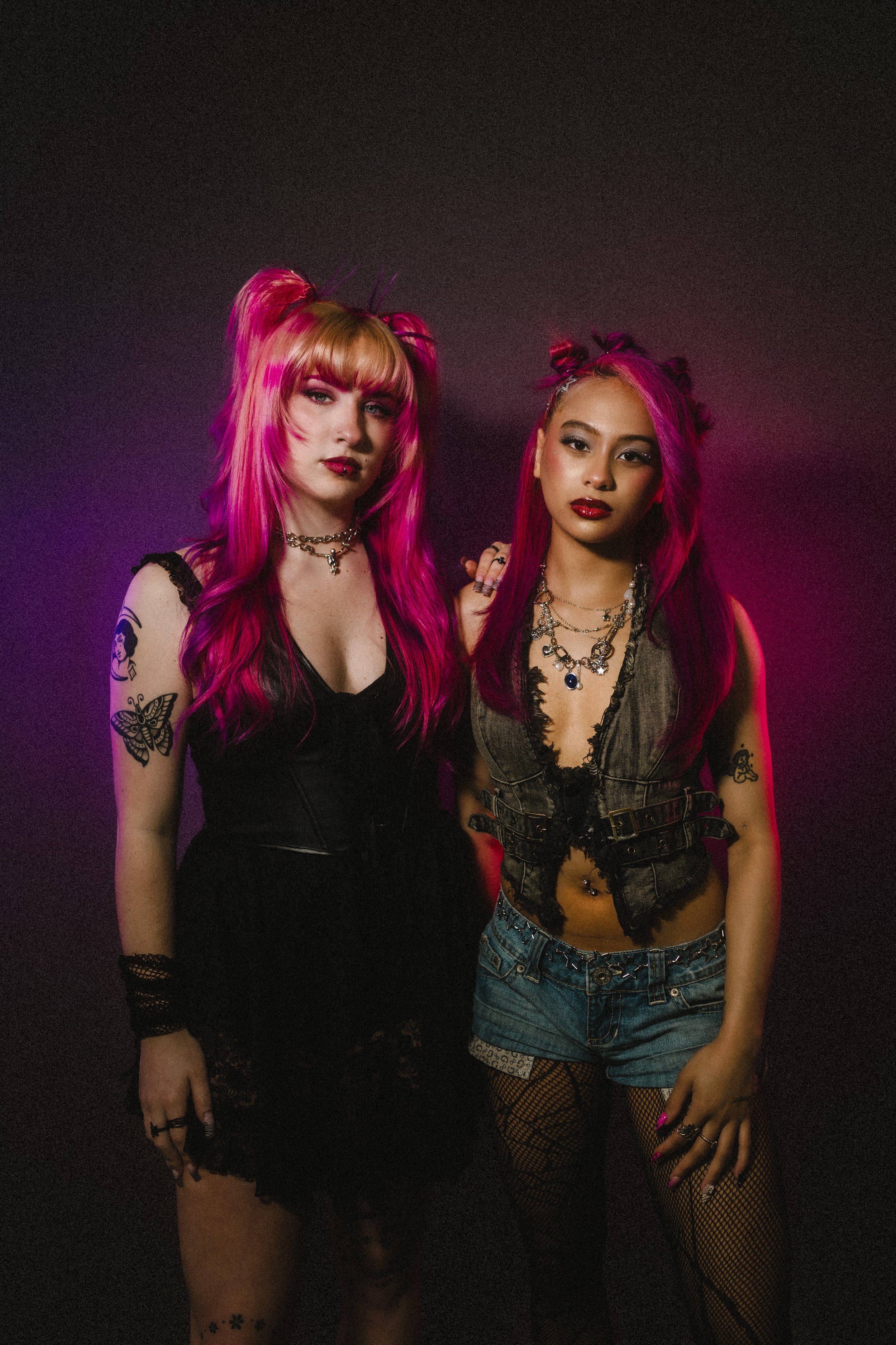 Models with bright pink vivid hair color by Alfa Jae Salon in Cary, NC