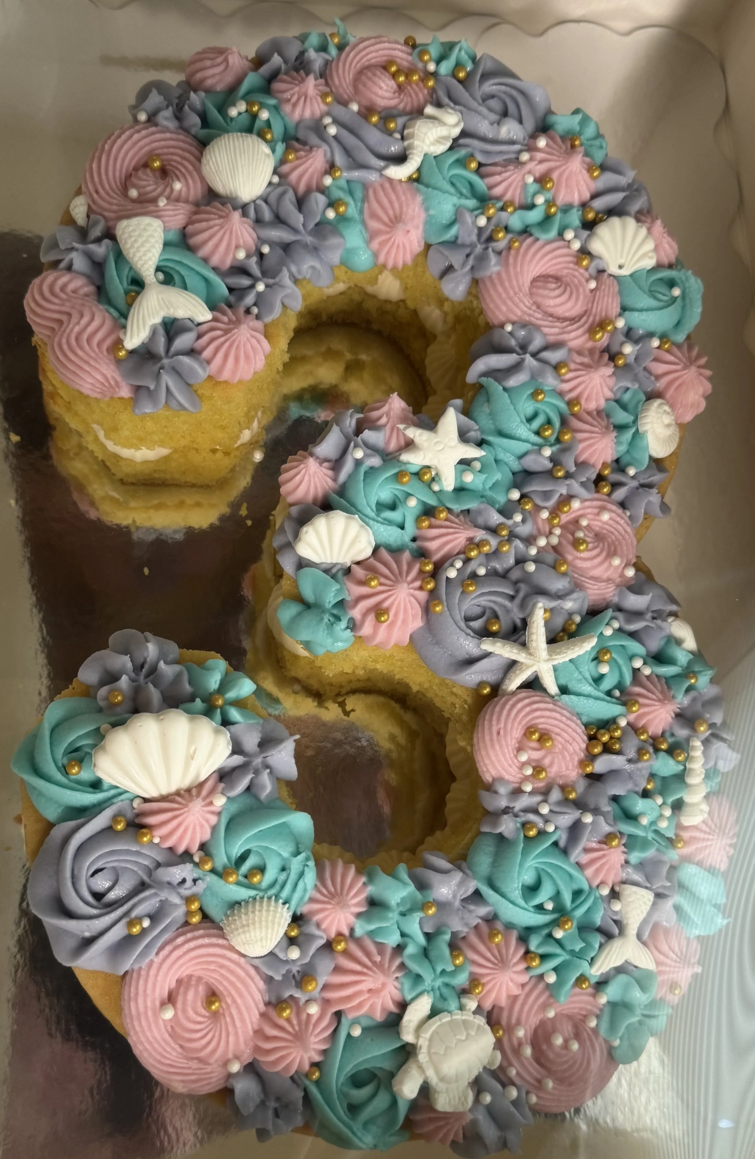 three shaped mermaid cake