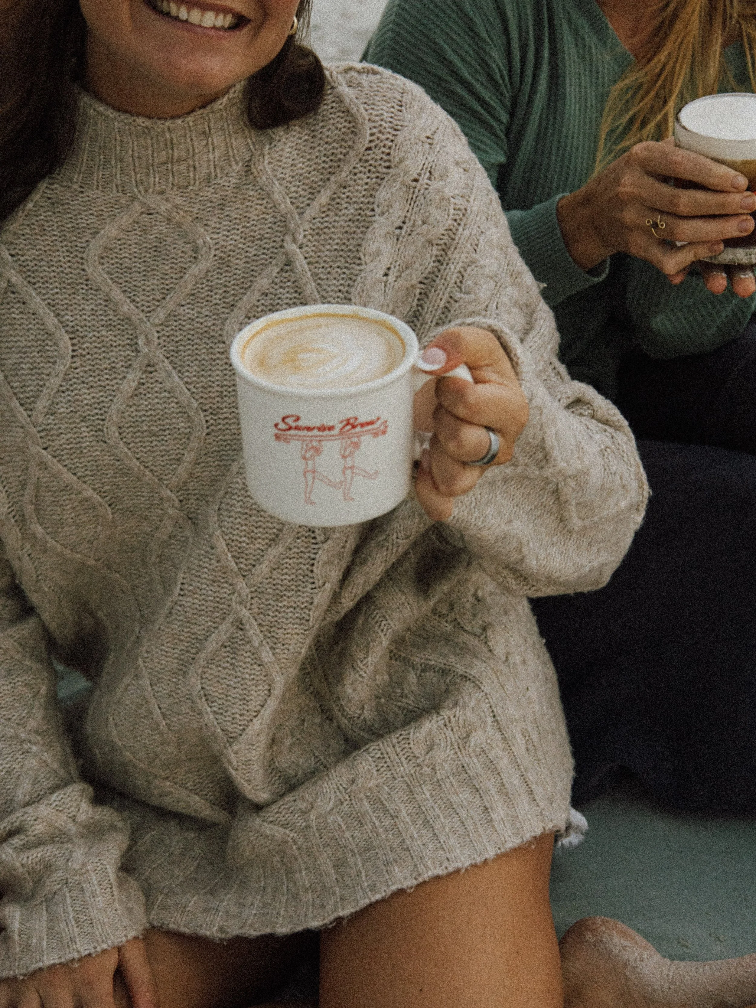 Sunrise Brew latte in a branded mug