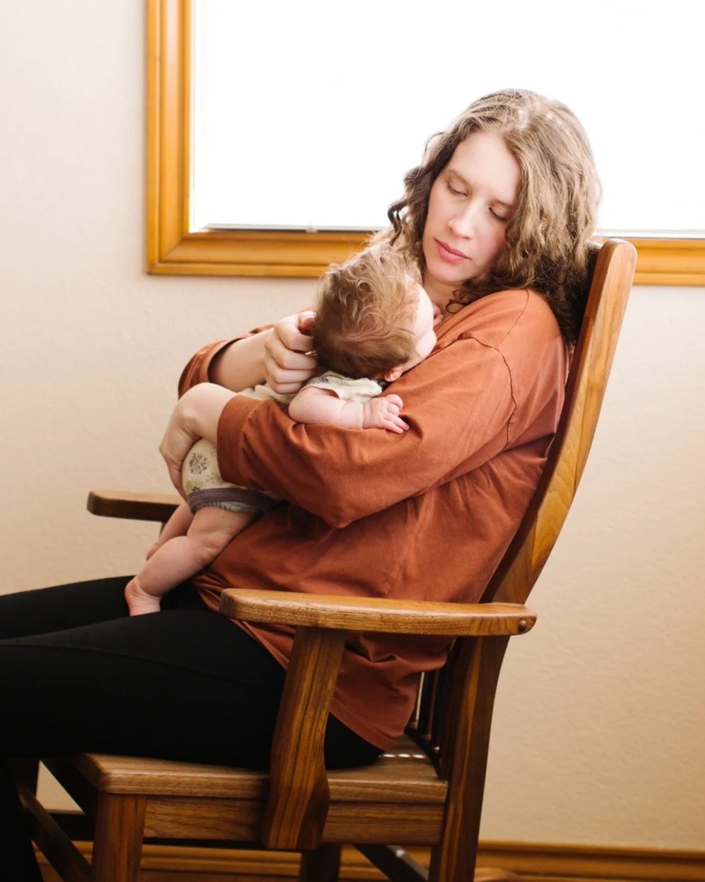 Dr. Kuster at home with her youngest daughter when she was an infant.