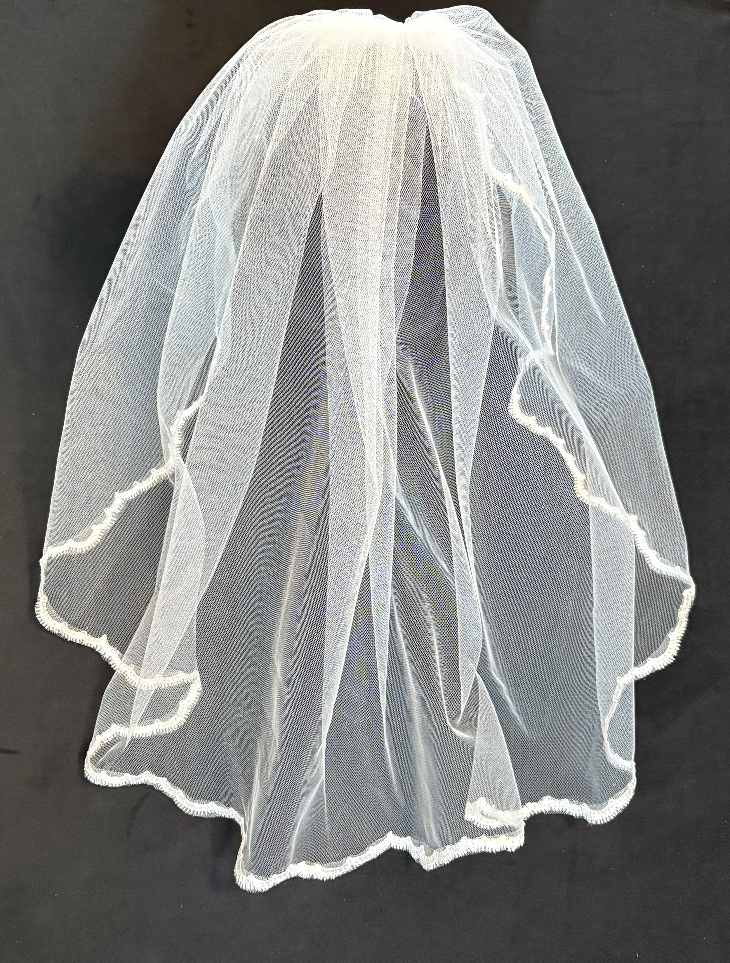 Embroidered White Trim on Comb
$50