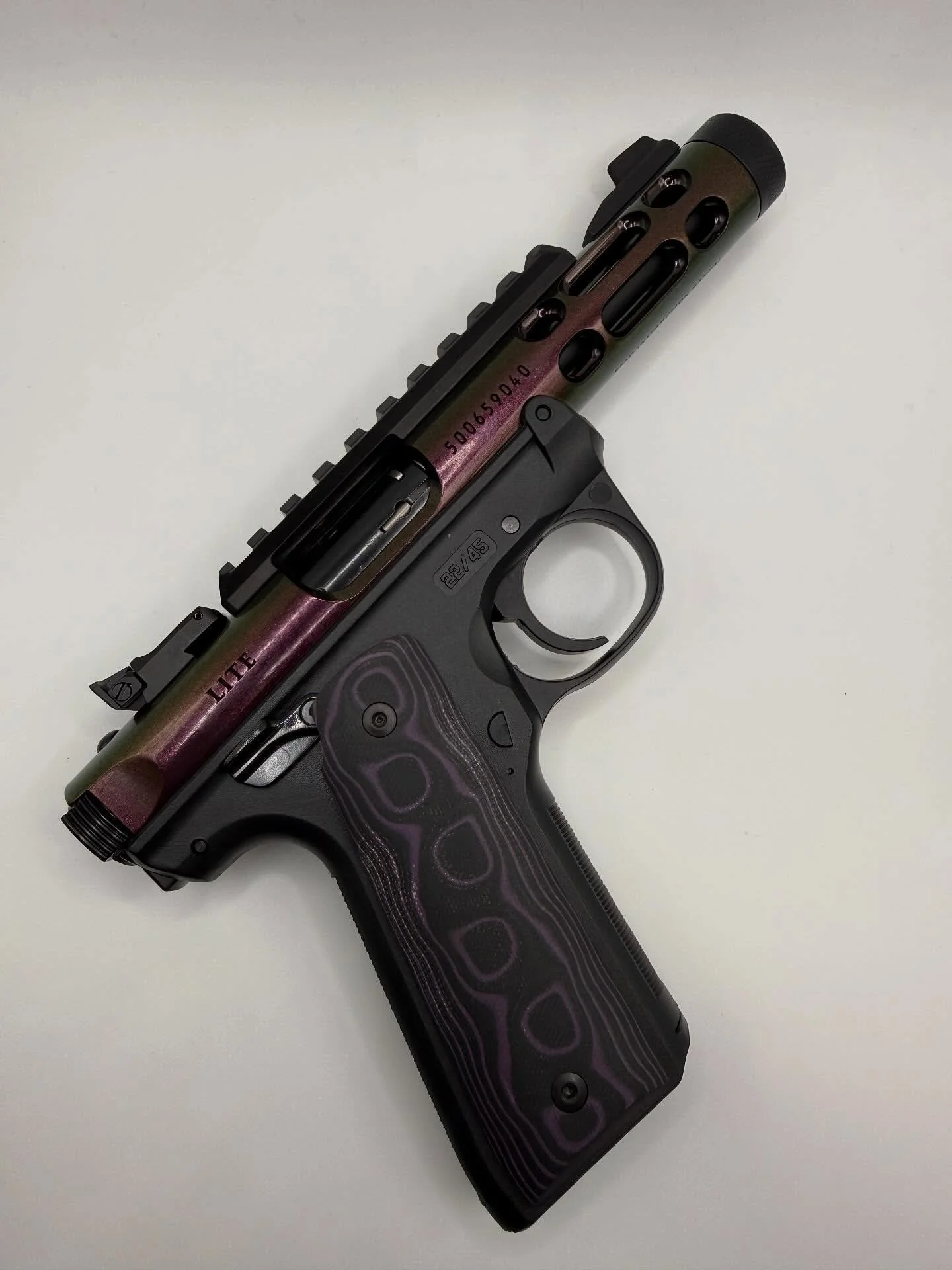 🔥 New Inventory Alert! 🔥
Check out this Ruger Mark IV Lite (.22LR) in Gun Candy &mdash; the color alone is a showstopper! It shifts and shimmers with the light, and those custom grips take it to another level. @rugersofficial 

Perfect mix of perfo