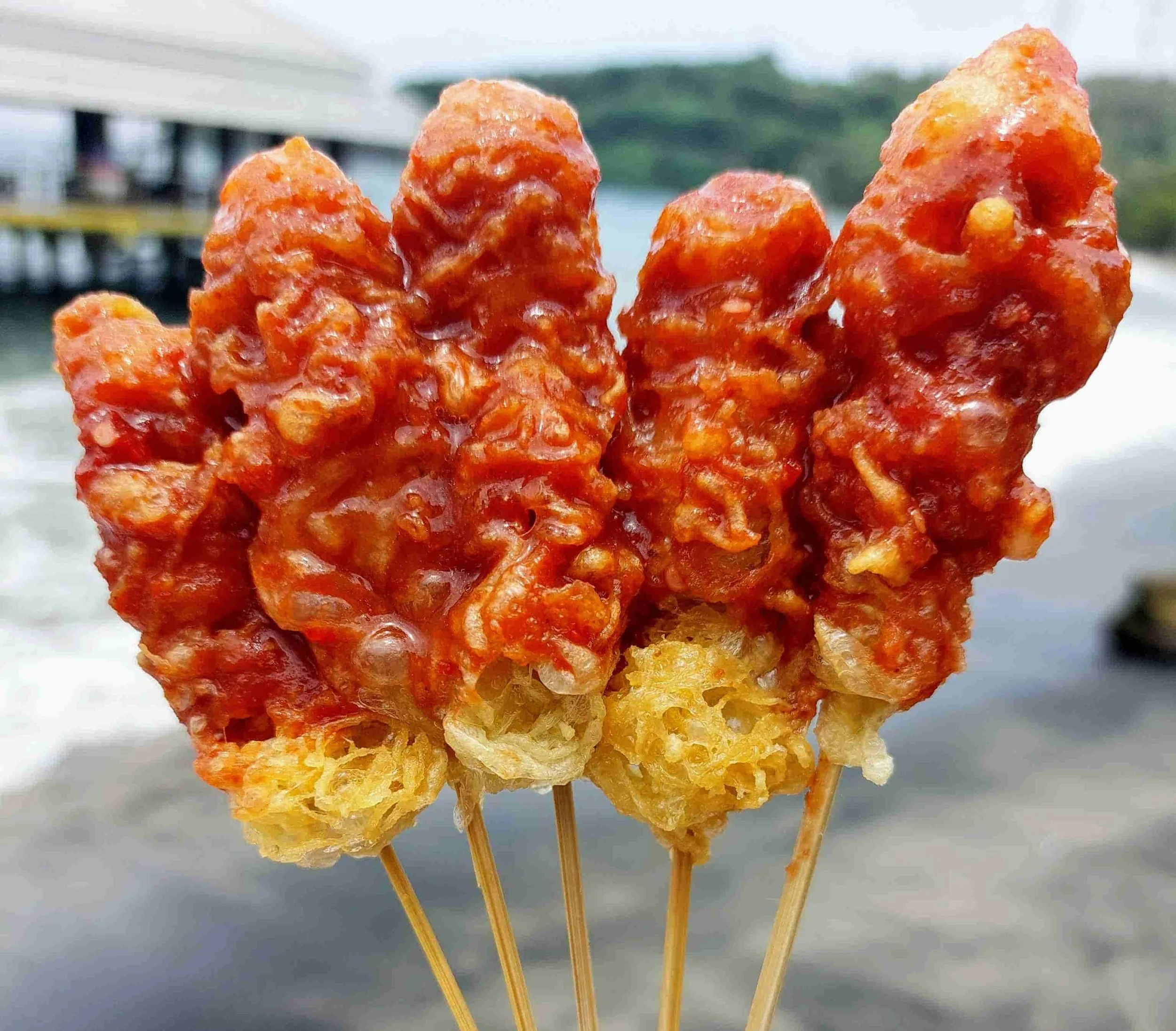 Crispy Indonesian sempol goreng chicken skewers served with spicy chili sauce
