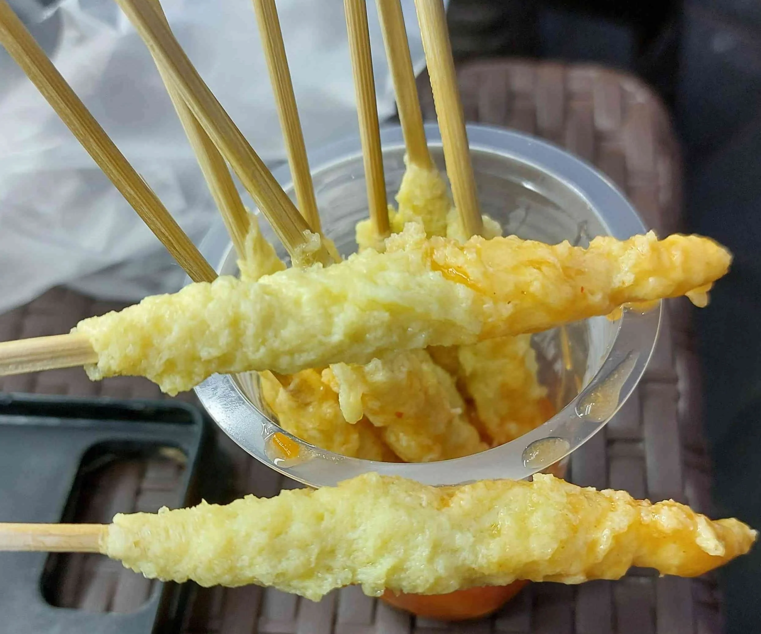 Indonesian telur gulung – rolled and fried egg snack on a stick