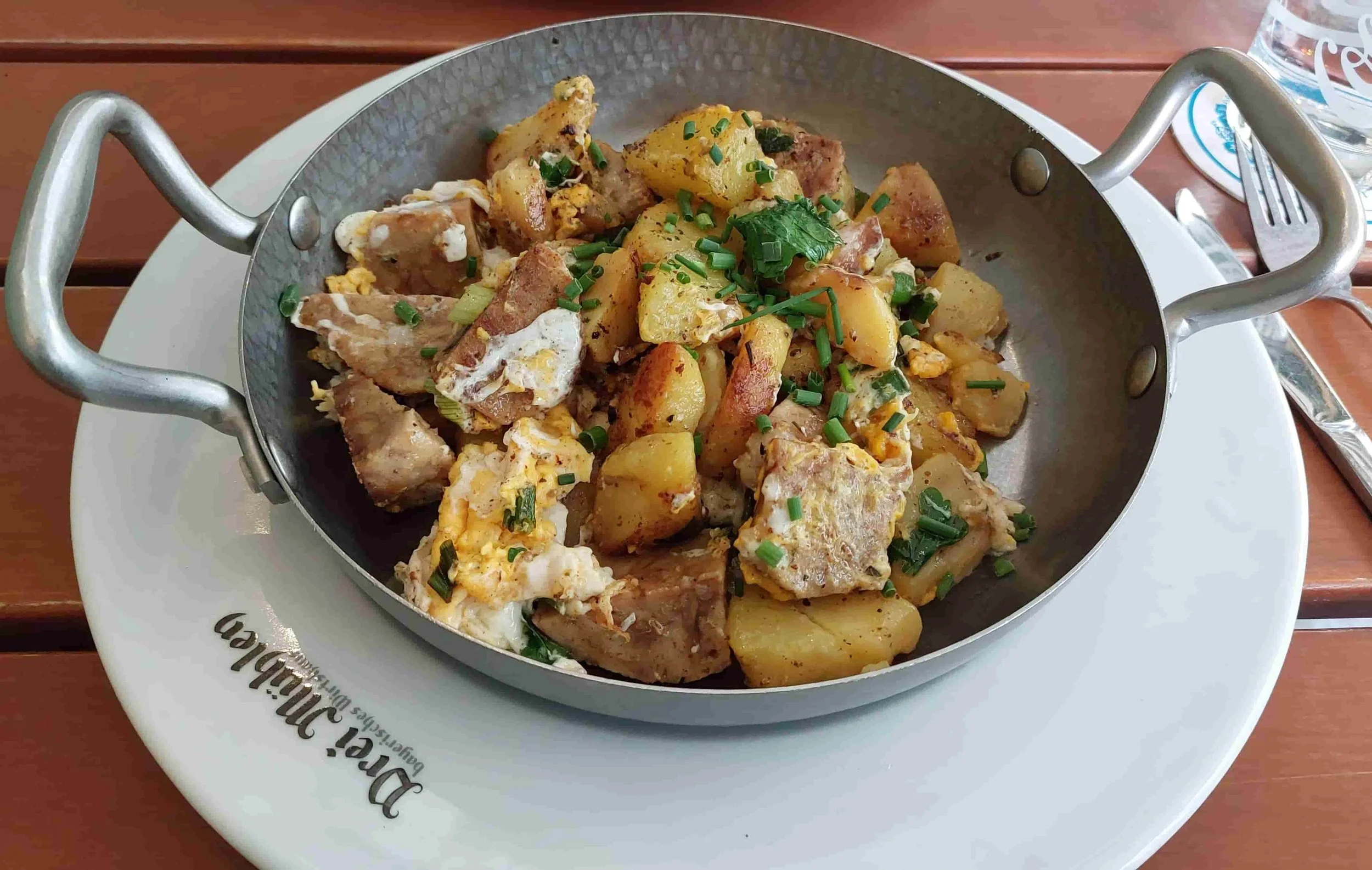 German Knödelgröstl fried bread and potato dumplings with potatoes and egg