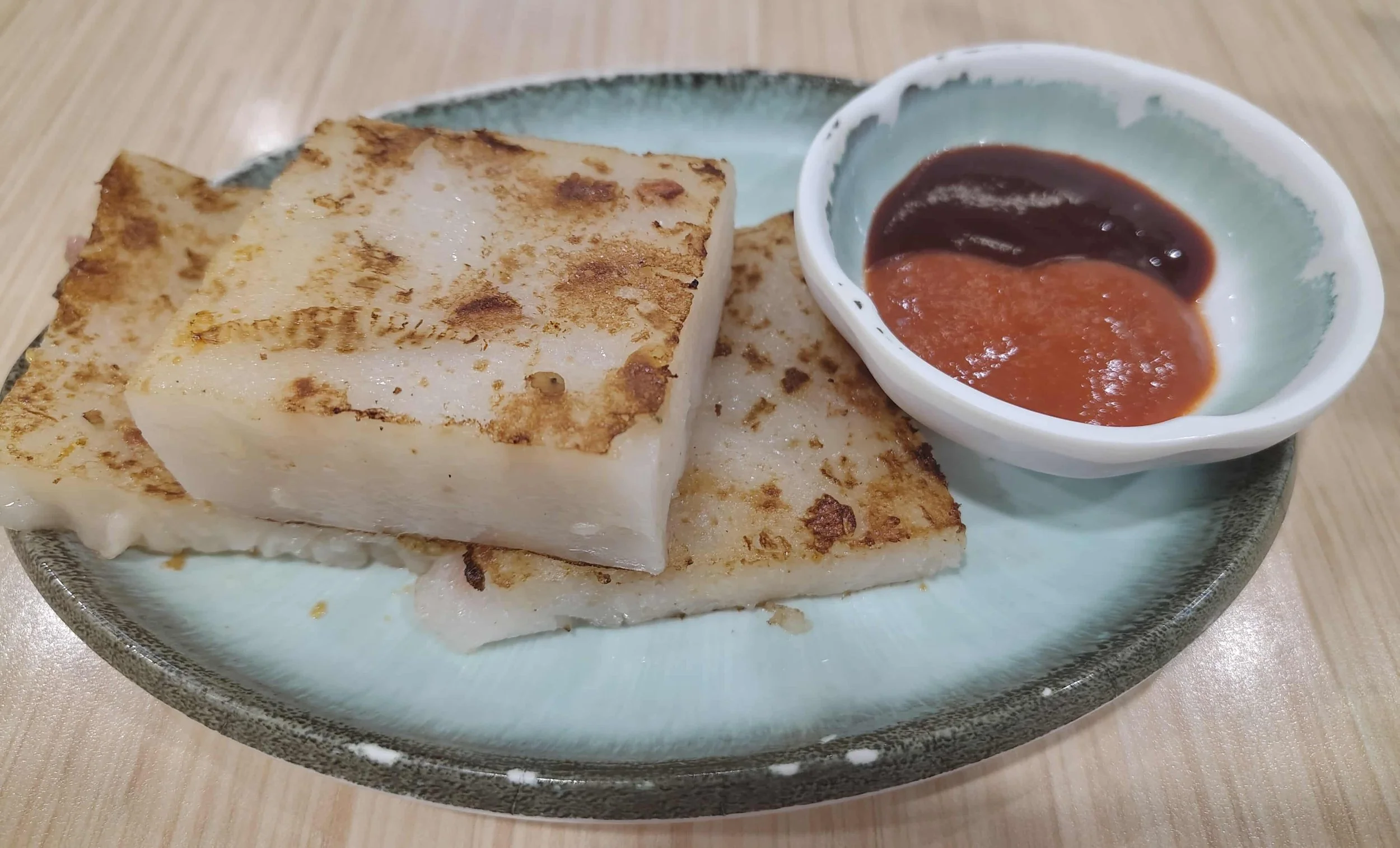 Turnip cake – Hong Kong-style pan-fried turnip cake served with dipping sauce