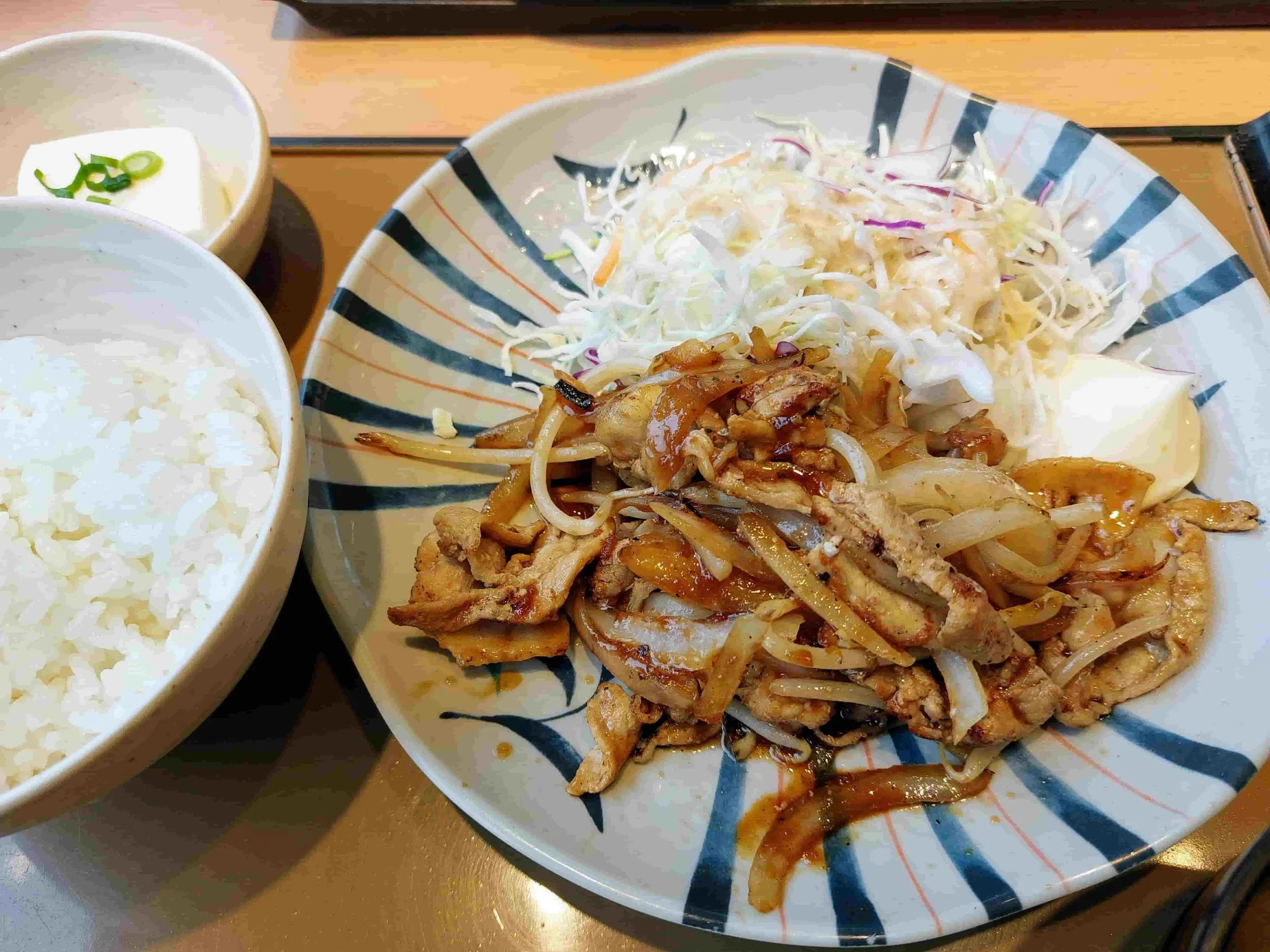 Traditional Japanese ginger pork dish, Buta no Shogayaki, served with steamed rice and side salad
