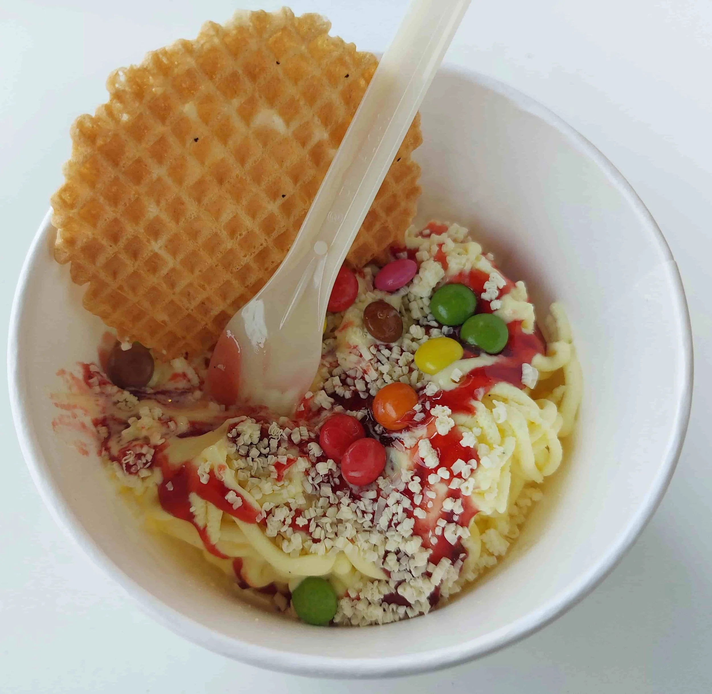 German Spaghettieis ice cream sundae made to look like spaghetti with strawberry sauce