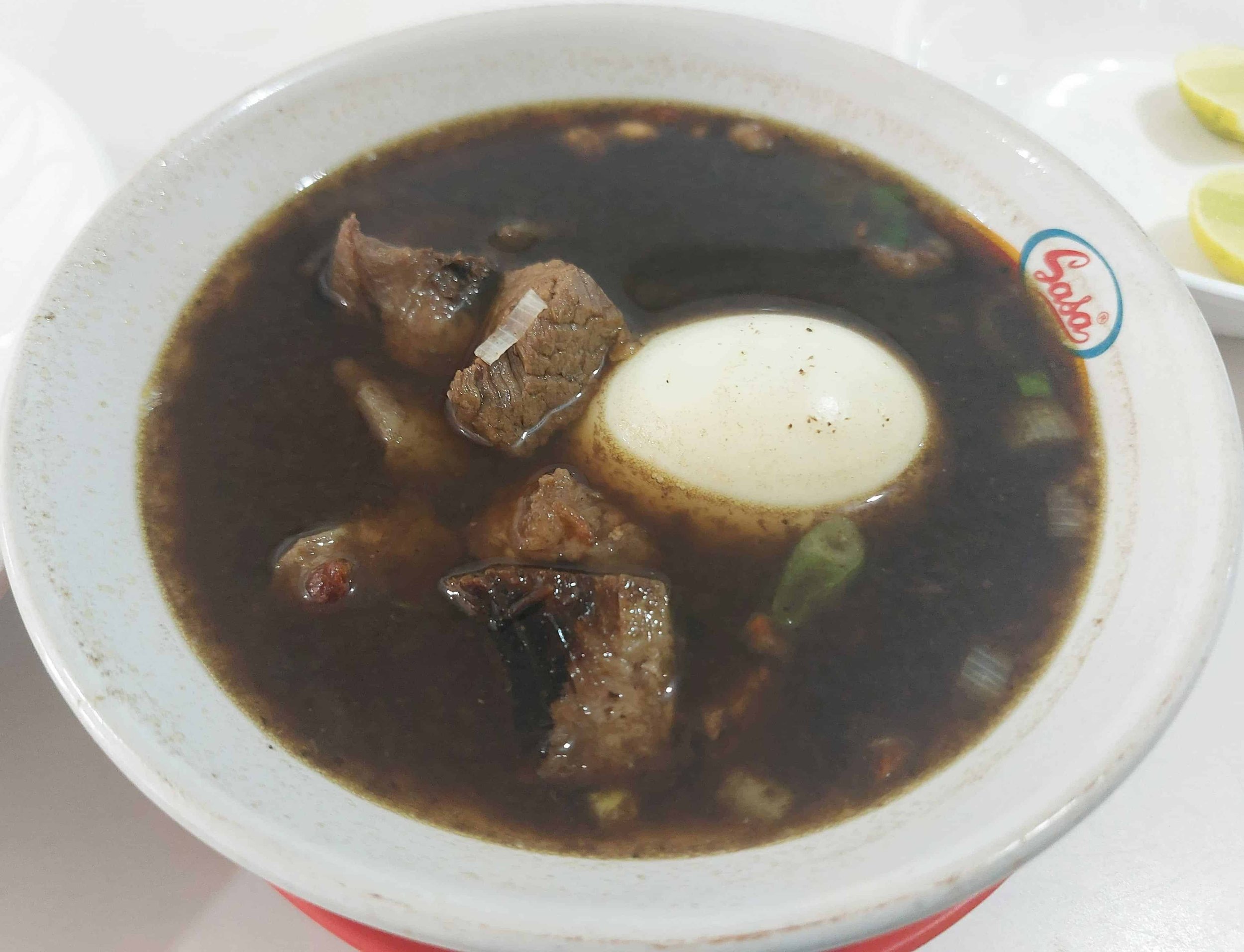 Rawon – East Javanese black beef soup made with kluwak nuts, tender beef chunks, and boiled egg