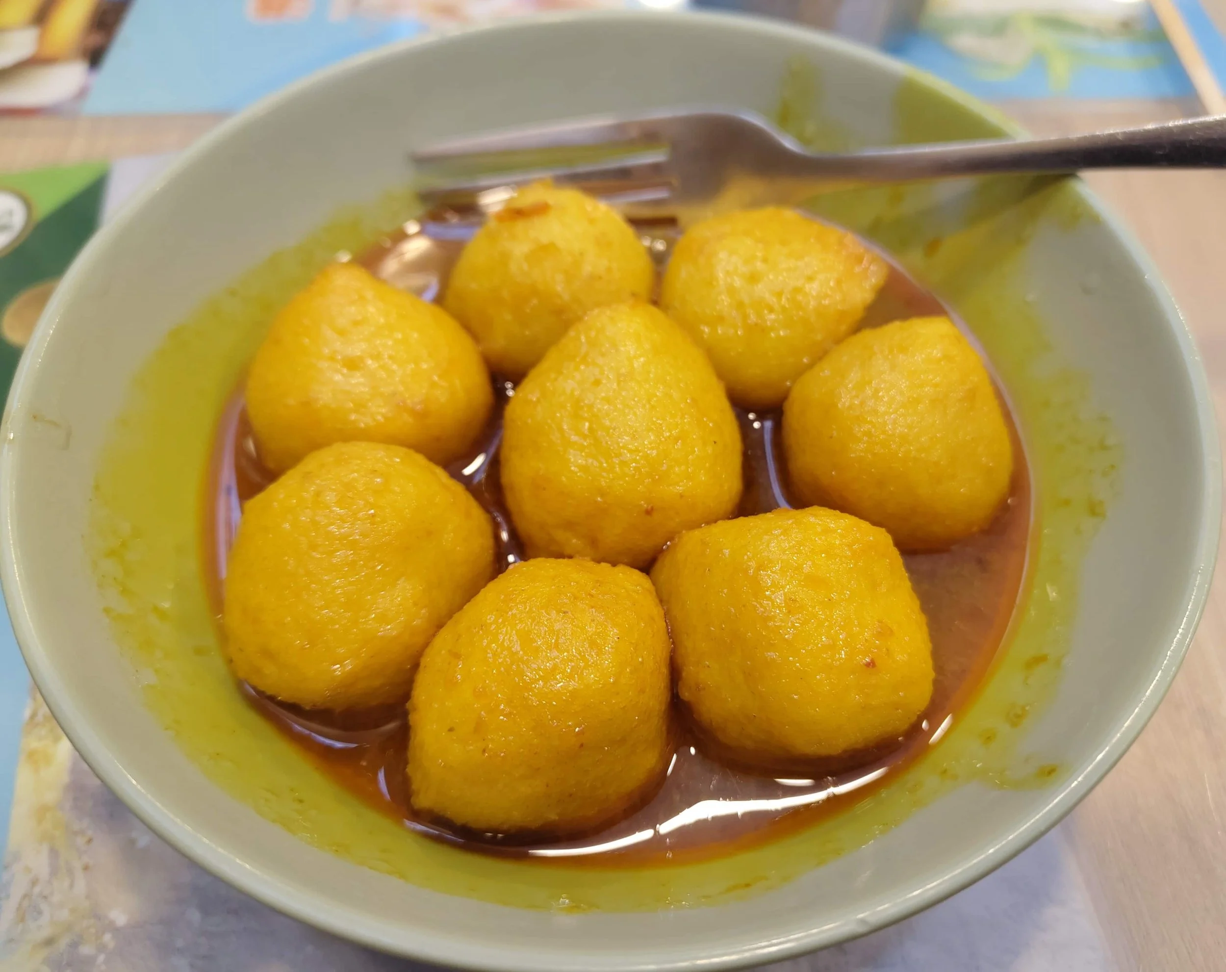 Eight Hong Kong curry fish balls served in a bowl