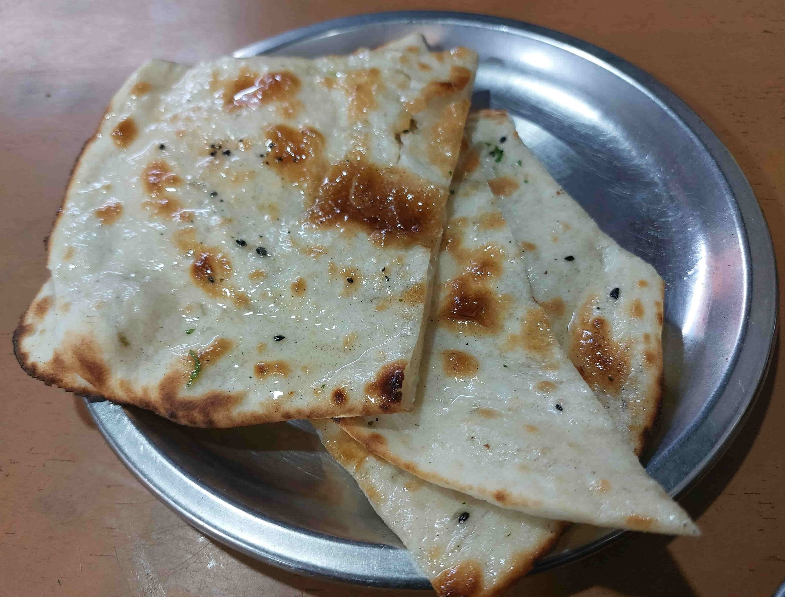 Naan – Indian tandoor-baked flatbread brushed with ghee