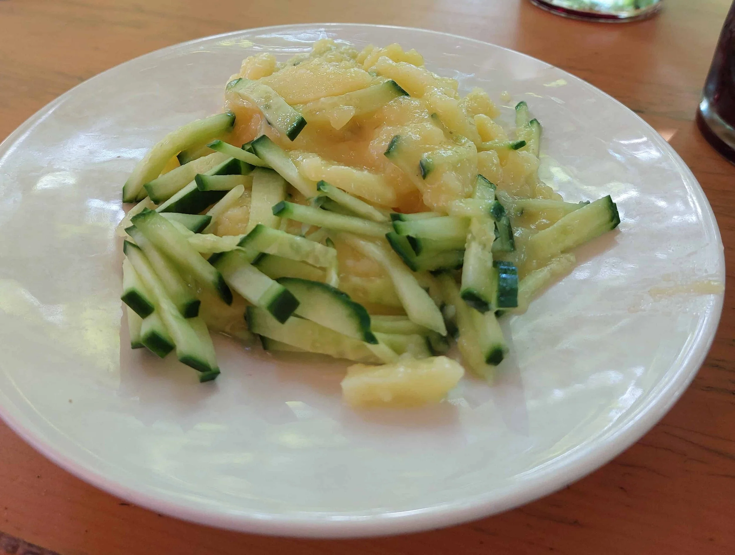 Traditional German kartoffelsalat potato salad with cucumber