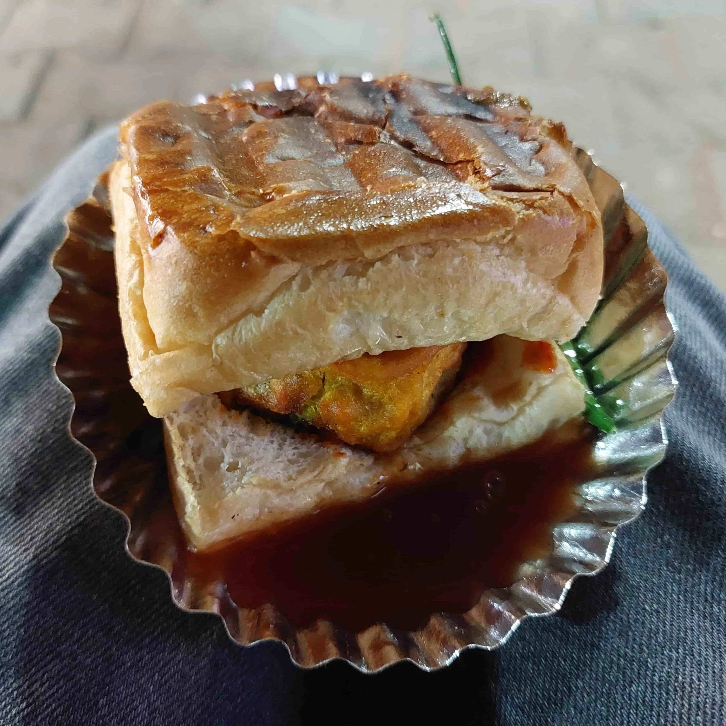 Vada pav – Indian potato fritter sandwich served in a soft bread roll with chutneys