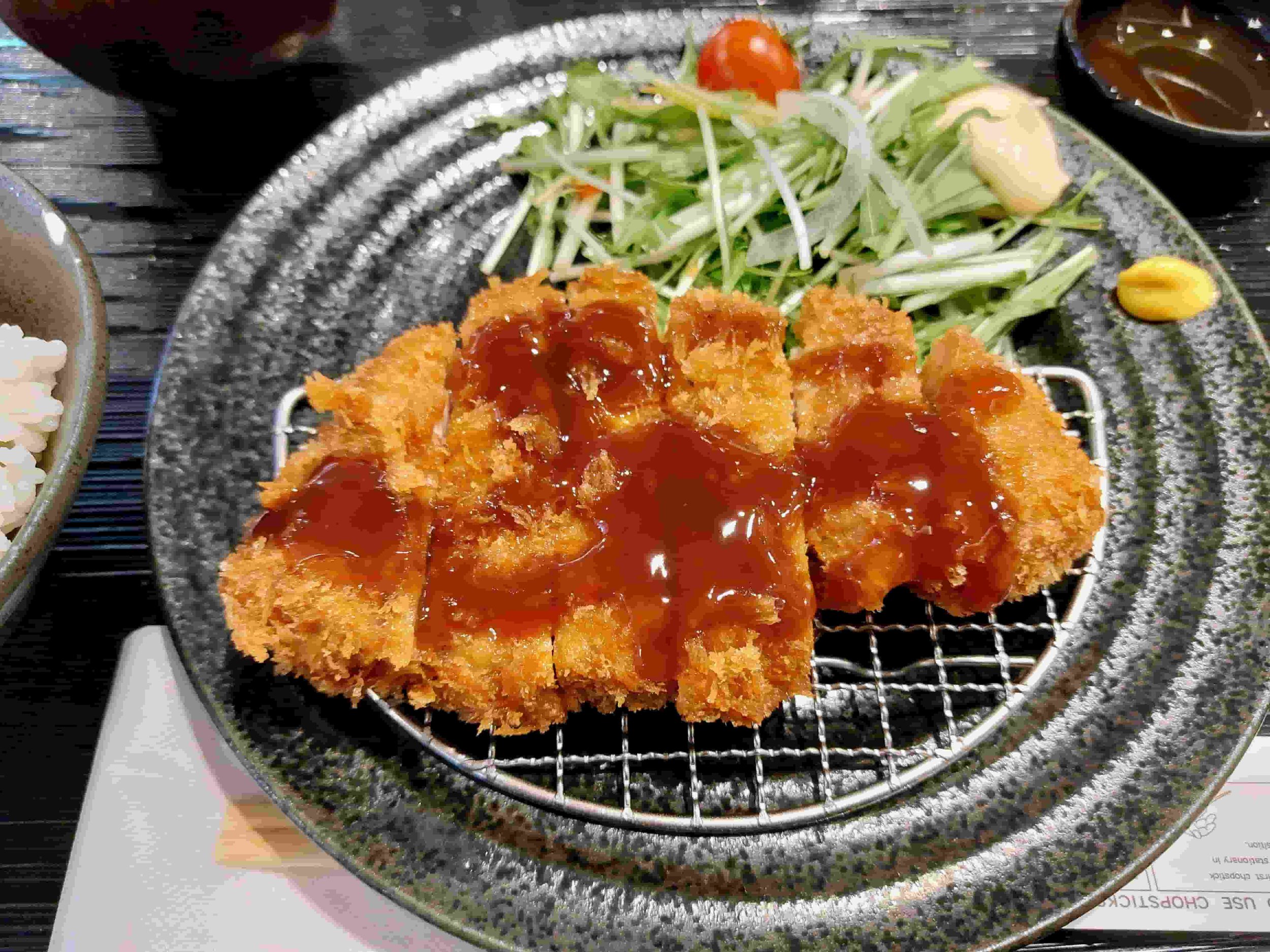 Crispy breaded tonkatsu pork cutlet served with dipping sauce