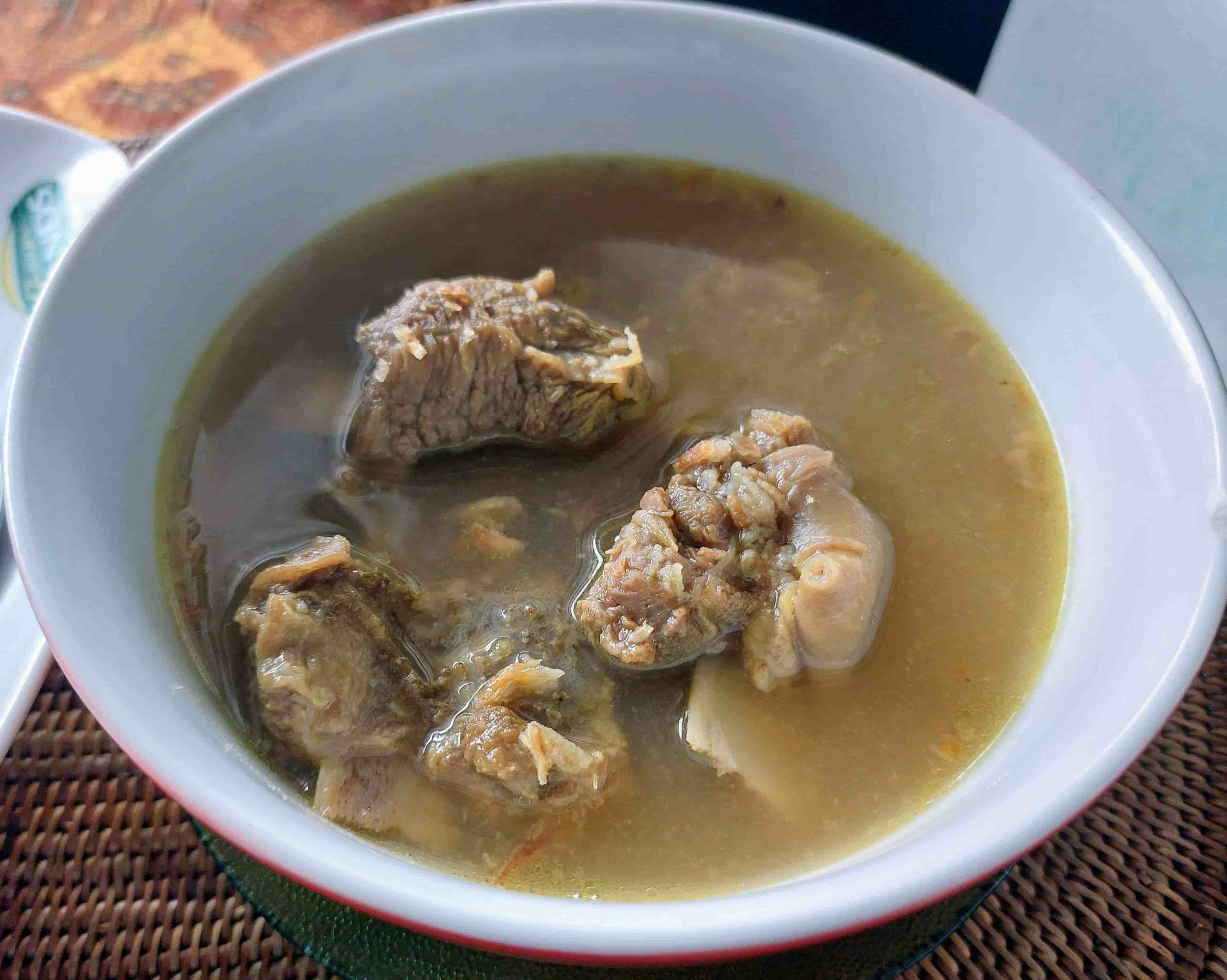 traditional Lombok soup made with goat ribs, simmered with garlic, shallots, ginger, and local spices, served hot with a tangy kick