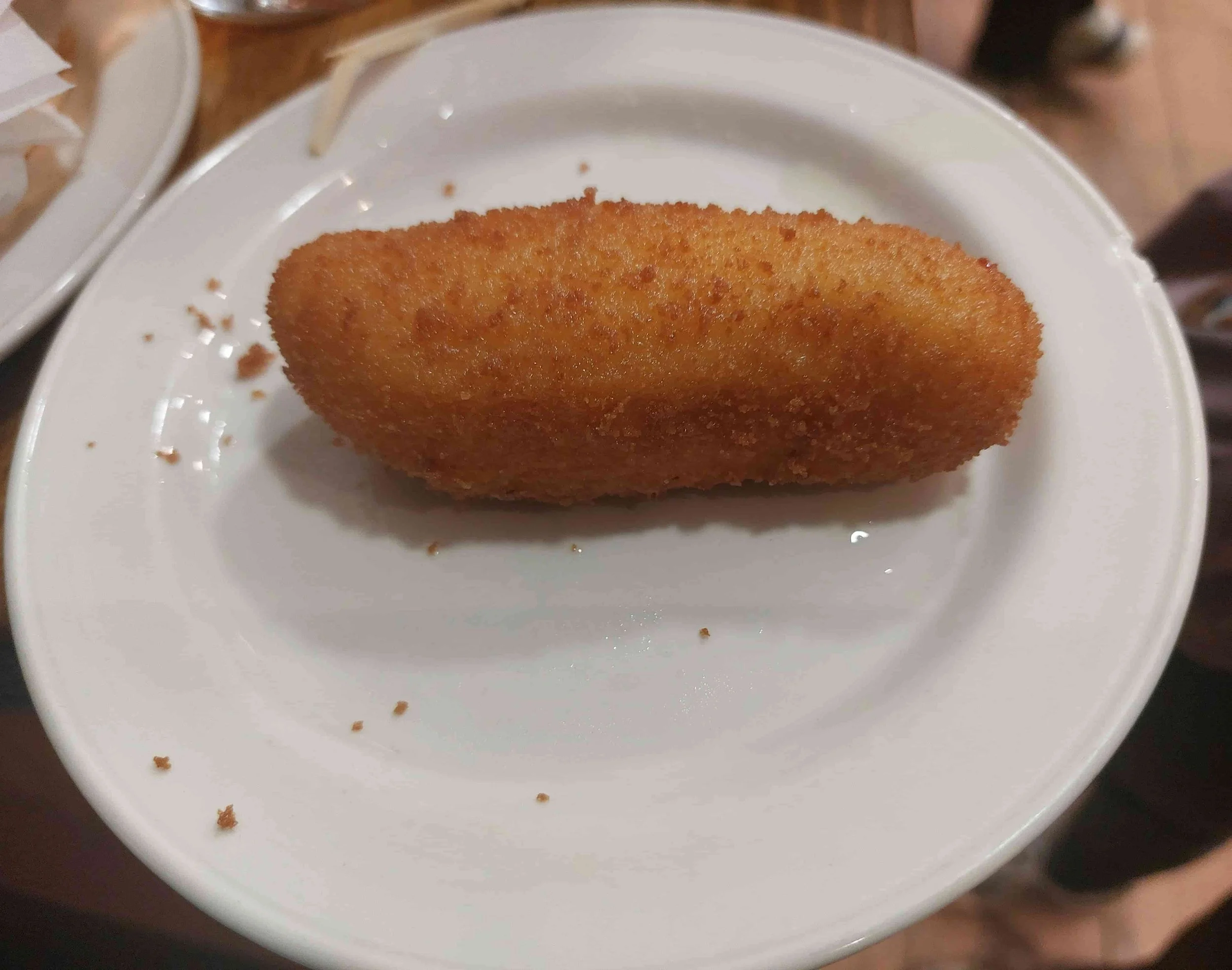 Spanish croquette breaded and fried, filled with creamy cheese