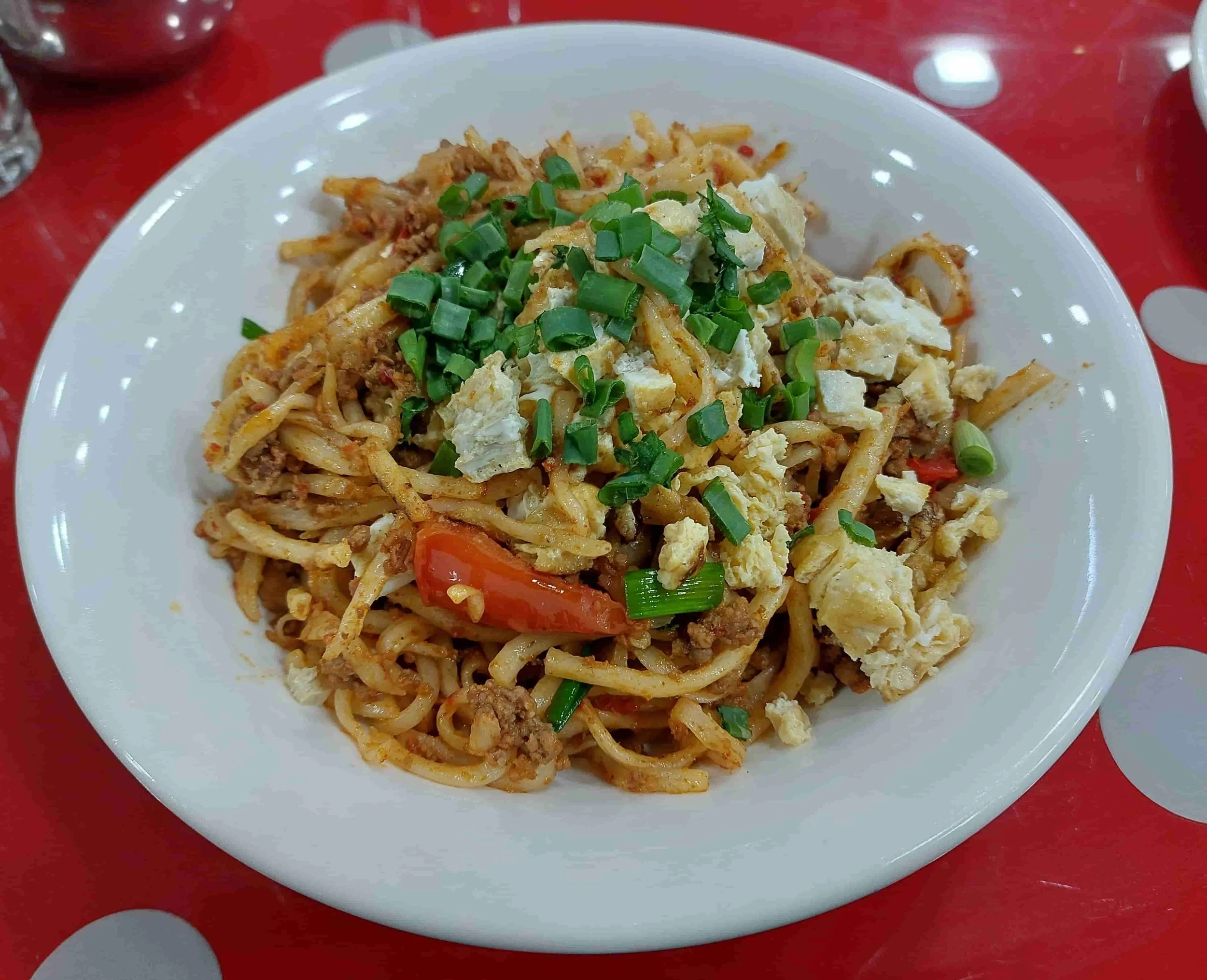 Uzbek Fried Lagman stir-fried hand-pulled noodles with beef, vegetables, and omelette bits