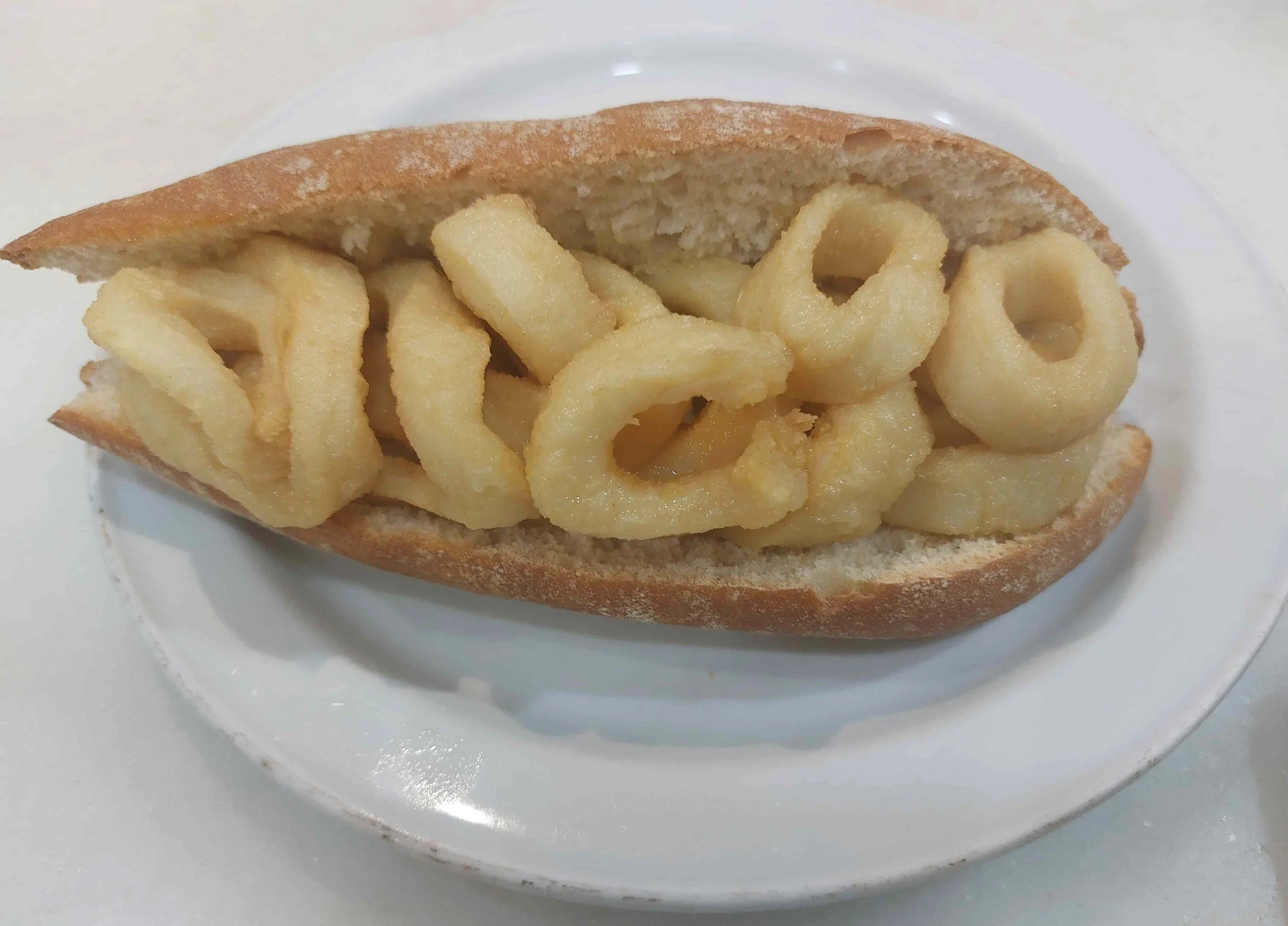 Spanish Bocadillo de Calamares fried calamari sandwich in crusty bread roll