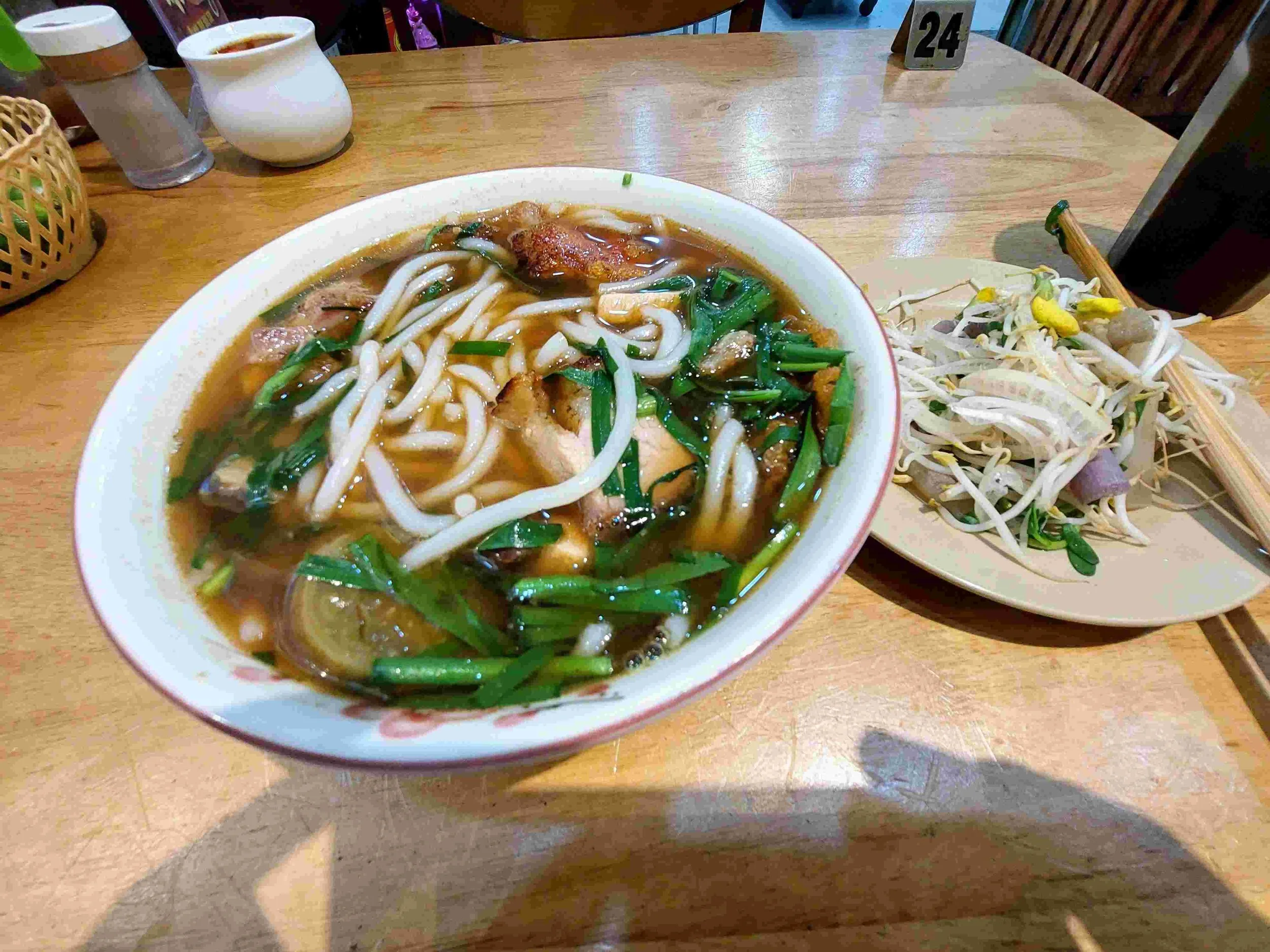 Bún Mắm – Vietnamese fermented fish noodle soup with rice noodles, seafood, and fresh herbs