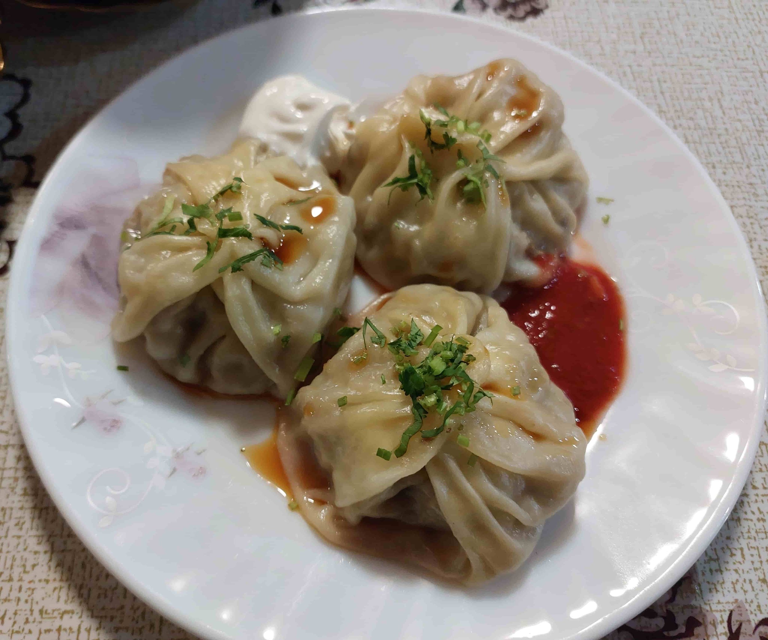 Uzbek manti steamed dumplings filled with minced meat and onions traditional dish