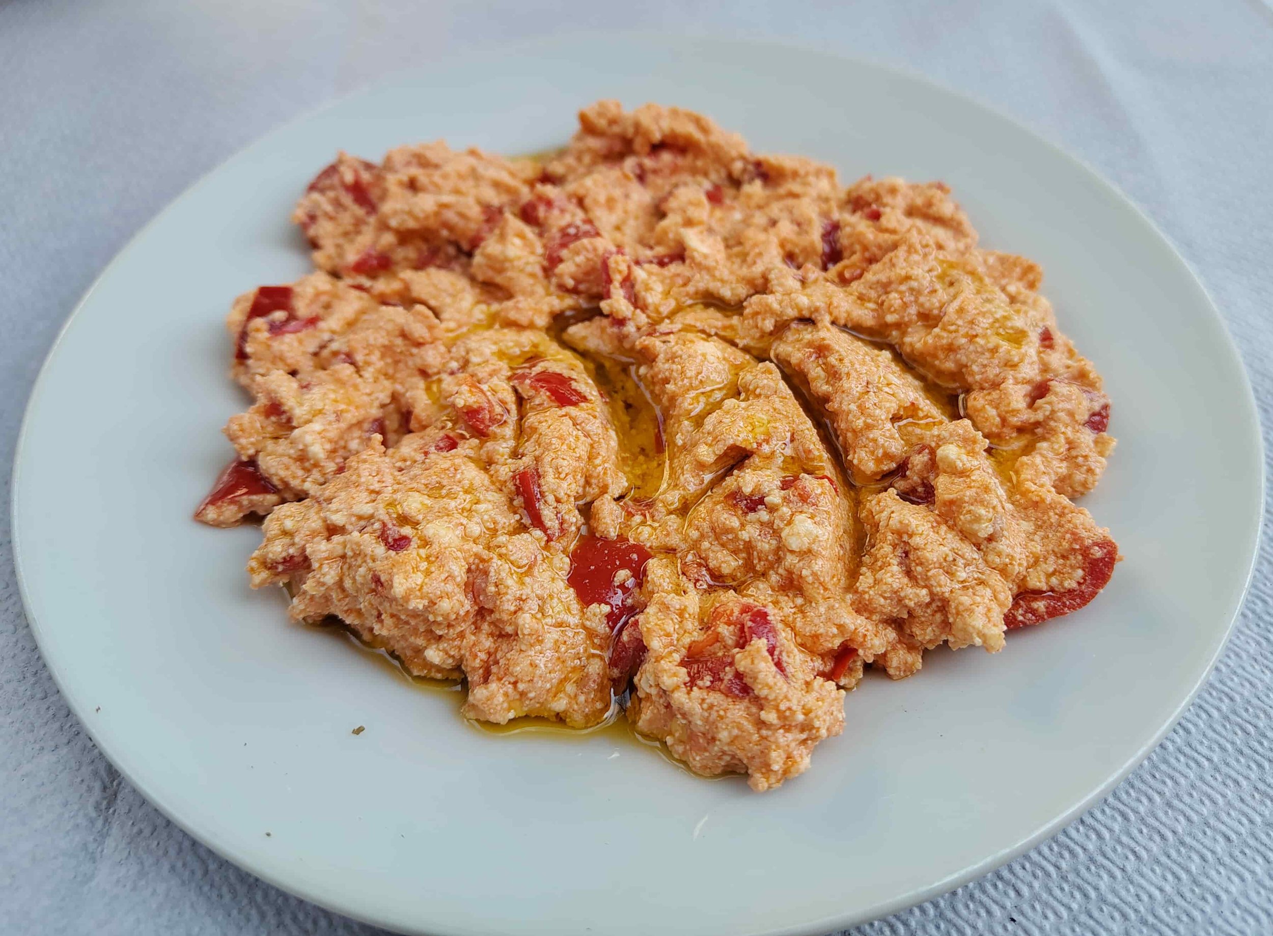 Fërgesë – traditional Albanian vegetarian dish with peppers, tomatoes, and cheese