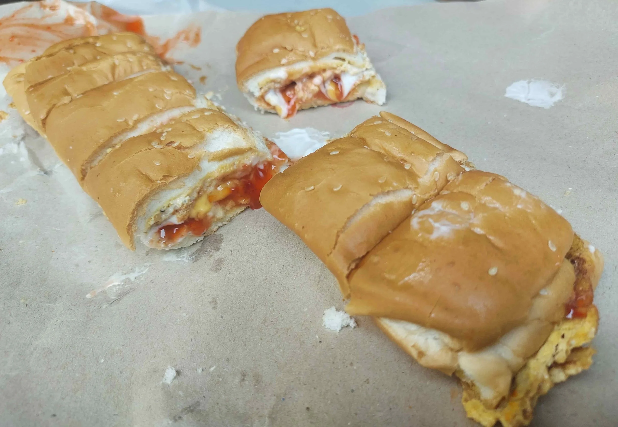 Roti John long roll with omelette, minced meat, onions, chili sauce & mayonnaise