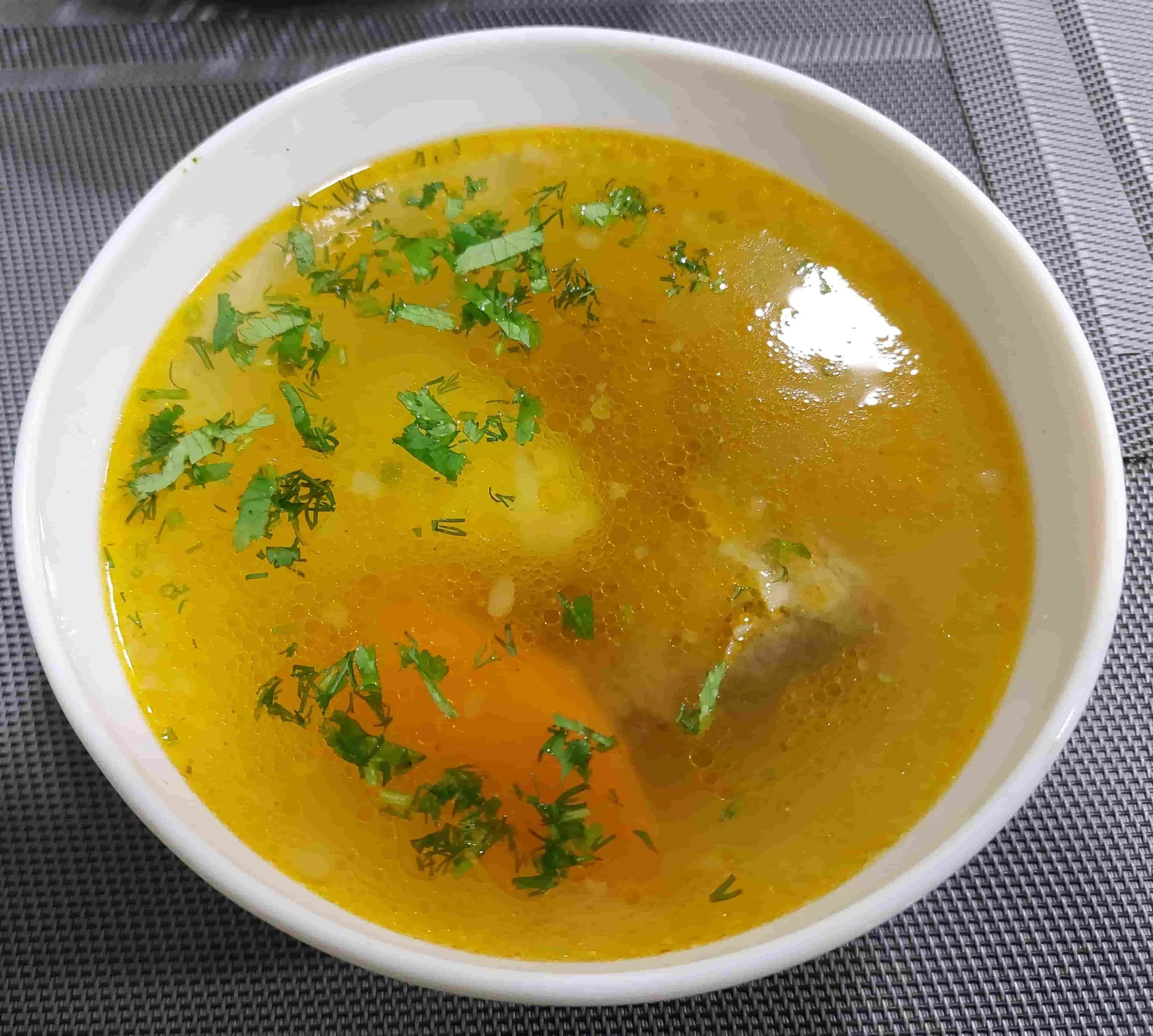 Uzbek Shurpa traditional meat and vegetable soup with broth