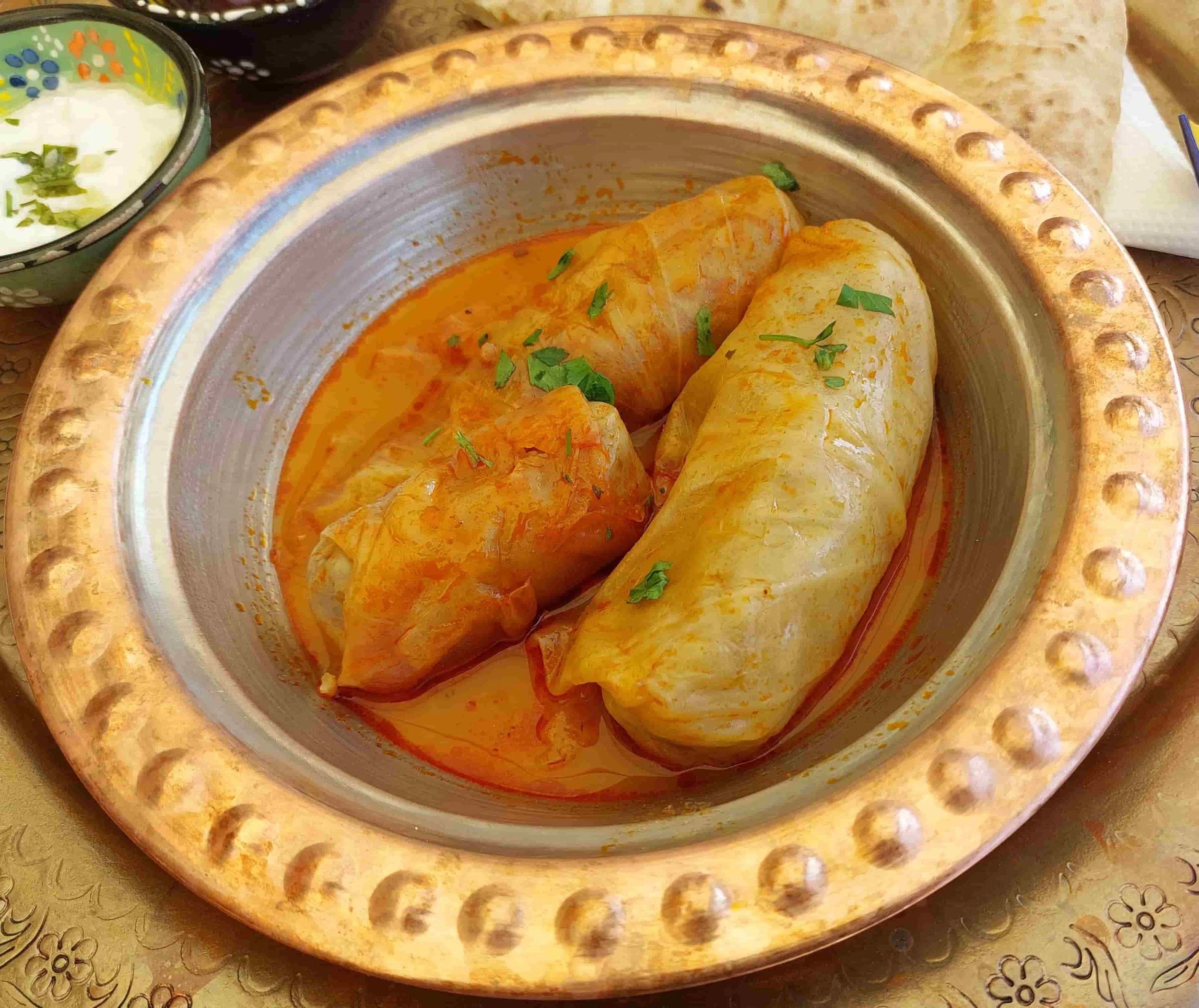 Bosnian Sarma – traditional stuffed cabbage rolls filled with a savory mixture of minced meat, rice, and spices, simmered in a rich broth