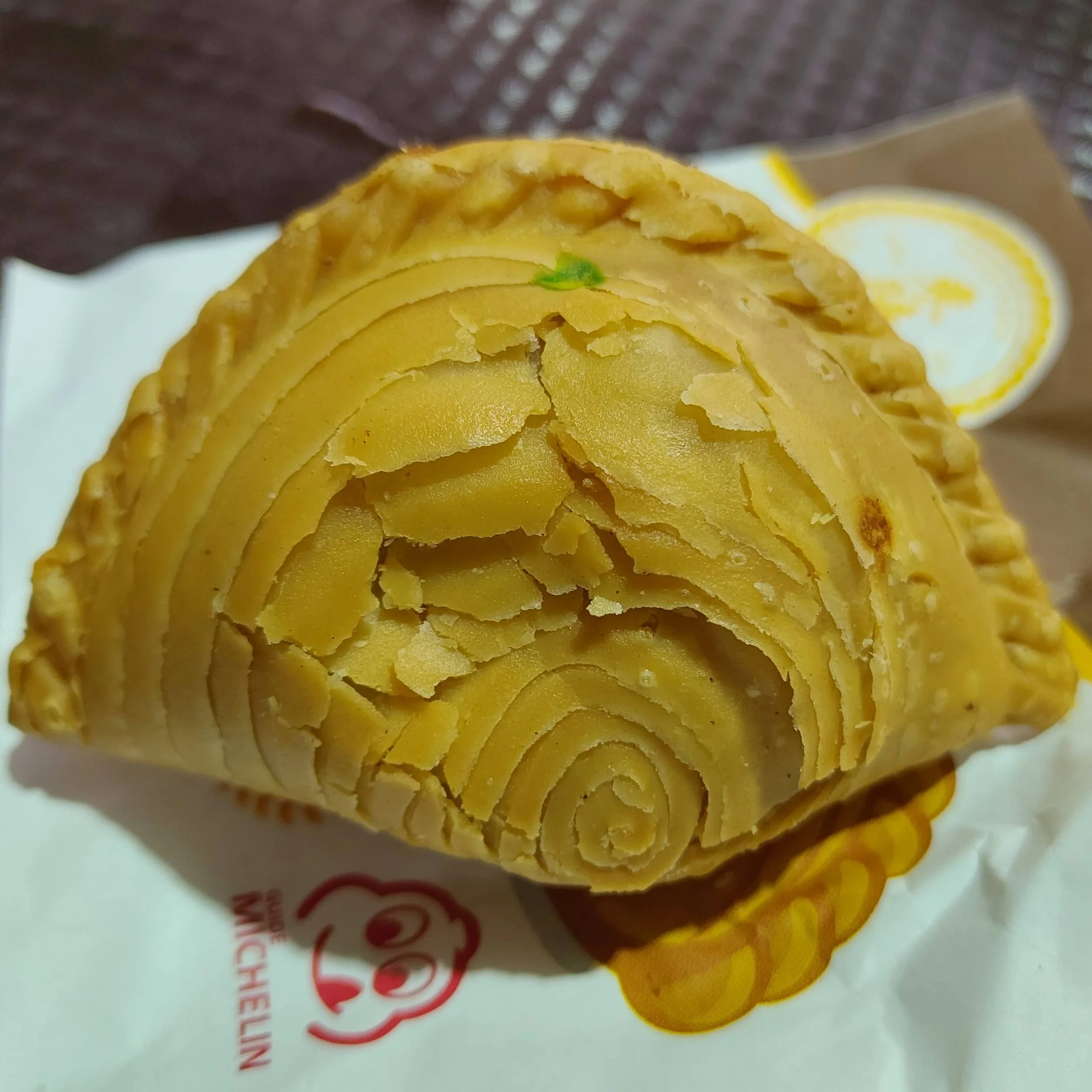 Singapore curry puff – golden pastry filled with curried potato and spices