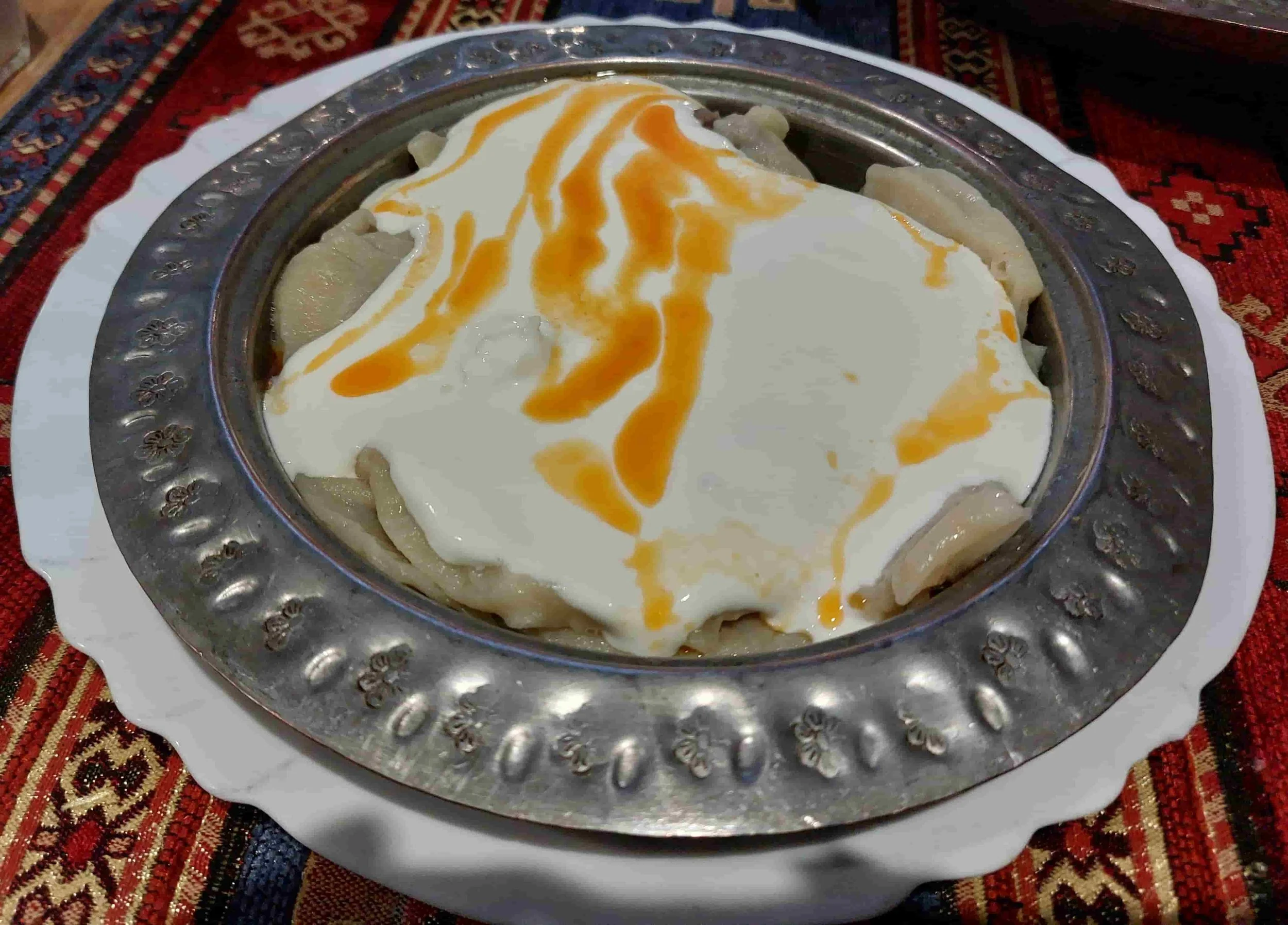 Traditional Bosnian klepe meat dumplings in creamy sauce