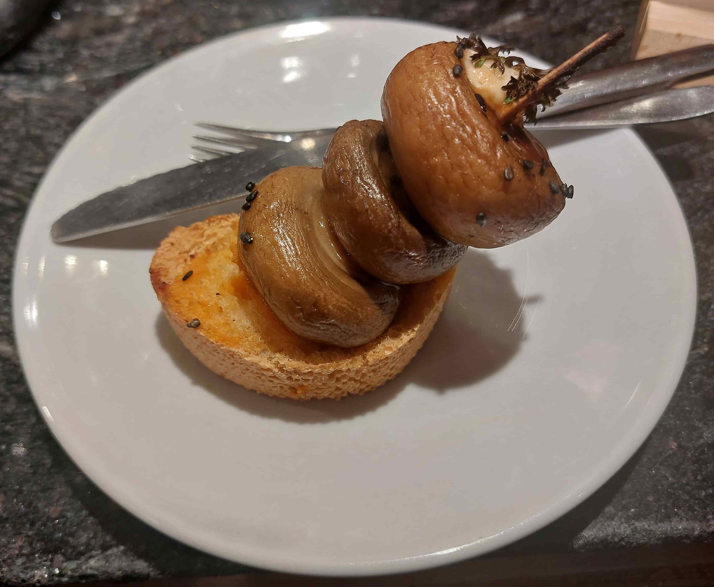 Basque champiñones a la plancha grilled mushrooms pintxos served on bread slice
