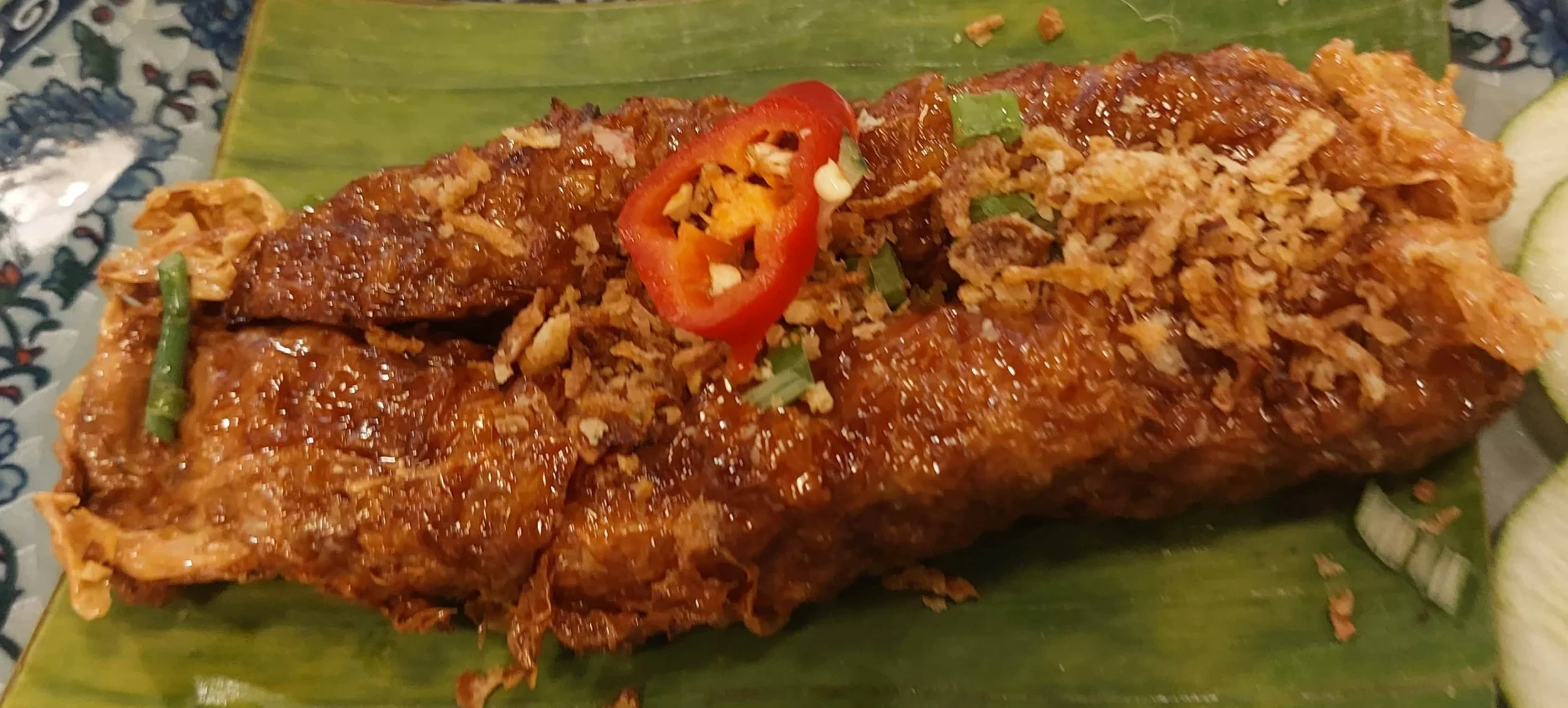 Penang loh bak (five-spice pork roll) deep fried with a chili