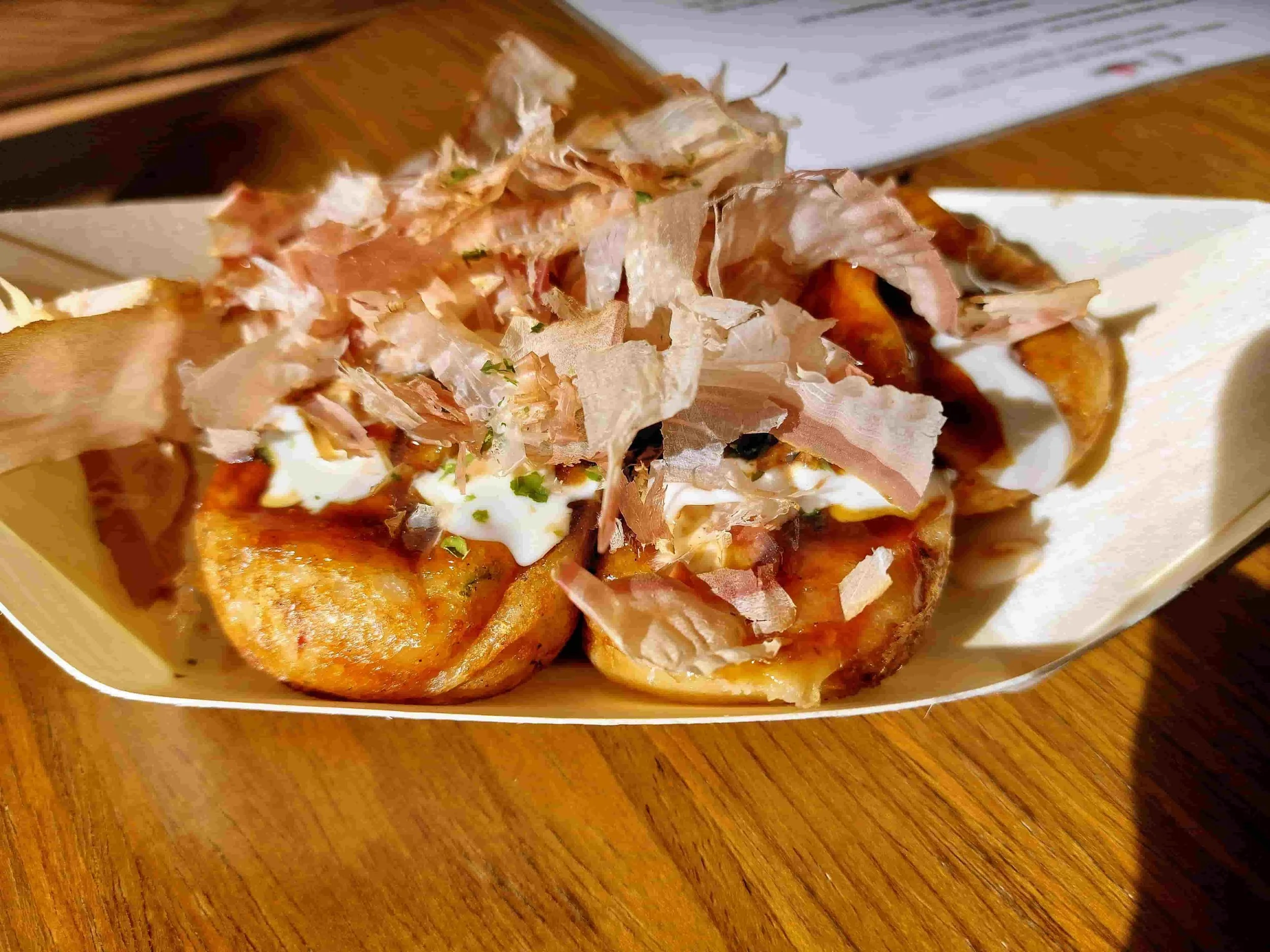 Japanese takoyaki – octopus balls topped with mayonnaise, takoyaki sauce, and bonito flakes