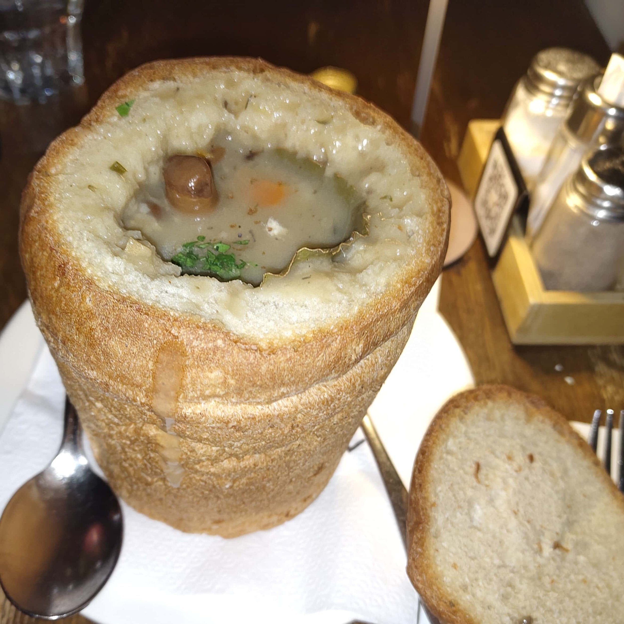 Gobova juha – traditional Slovenian mushroom soup served in a bread bowl