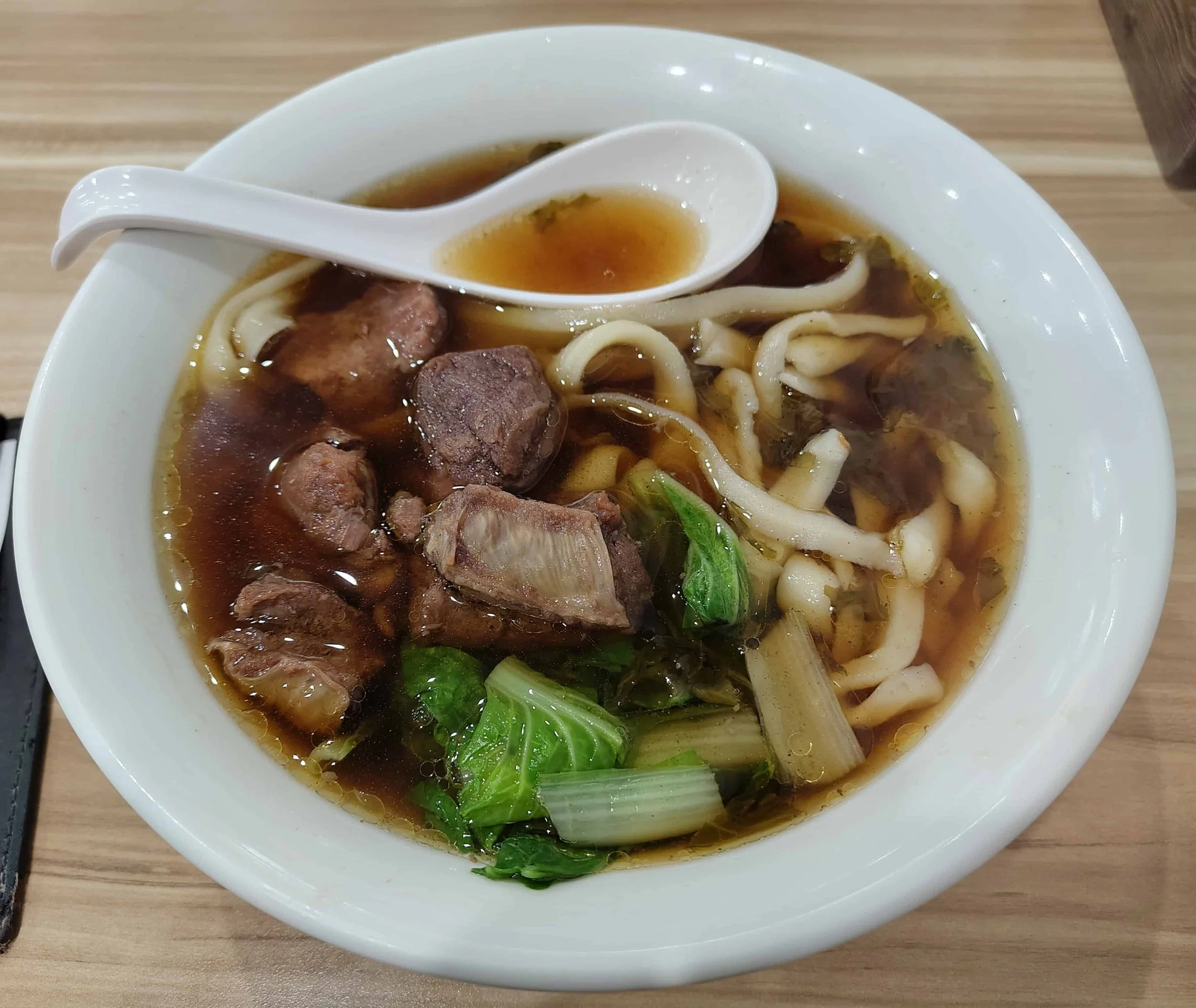 Taiwanese beef noodle soup – braised beef with noodles and greens in broth