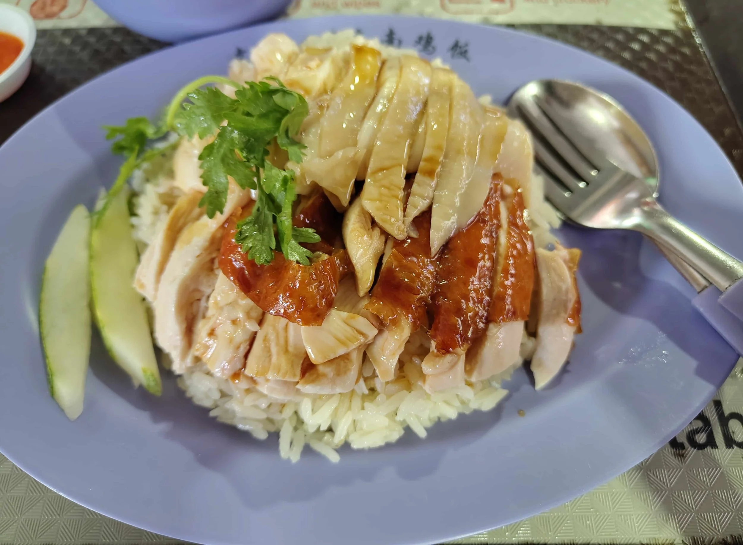 “Hainanese chicken rice – Singapore poached and roast chicken served with seasoned rice