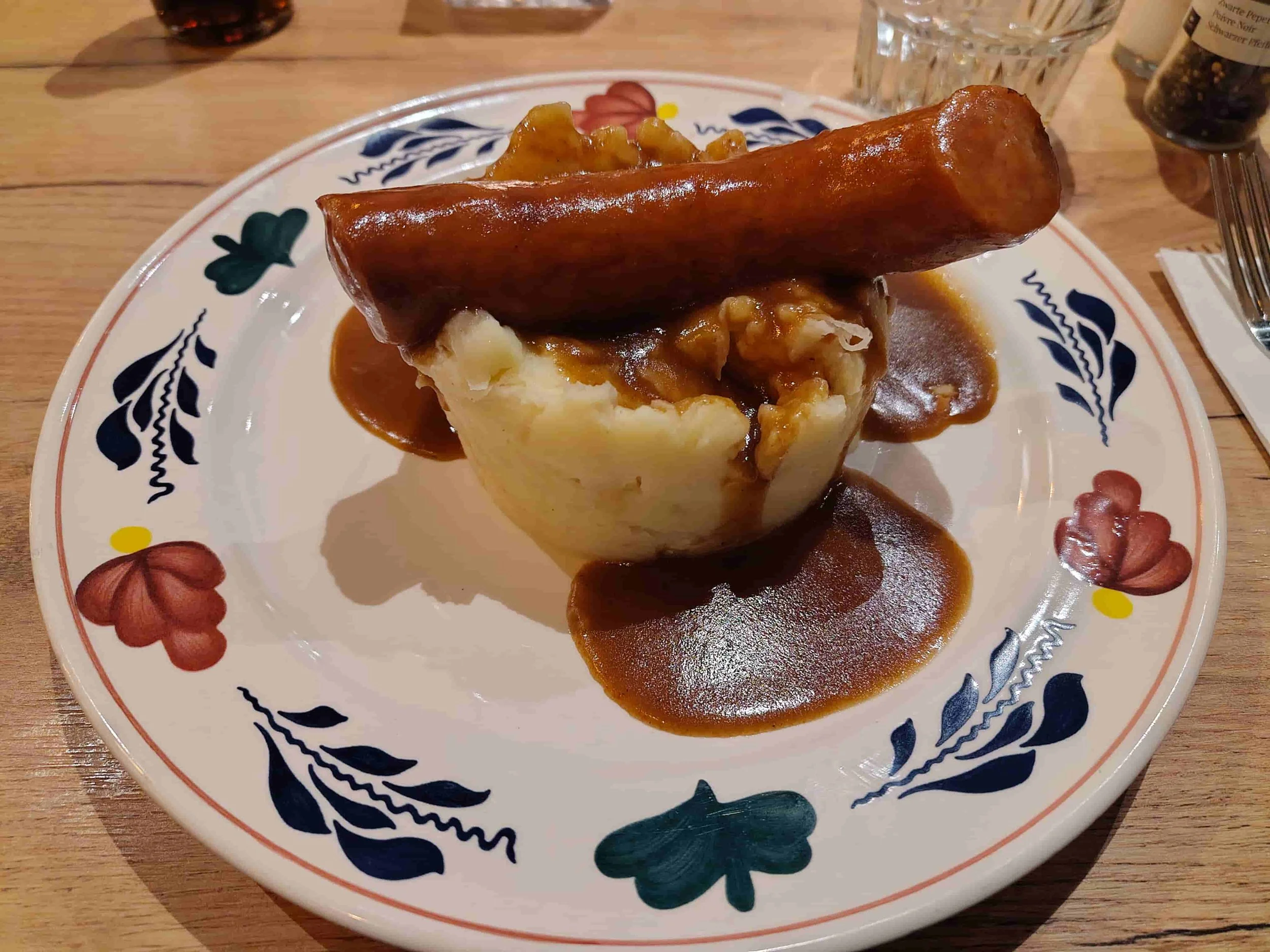 Dutch stamppot served with rookworst sausage and gravy
