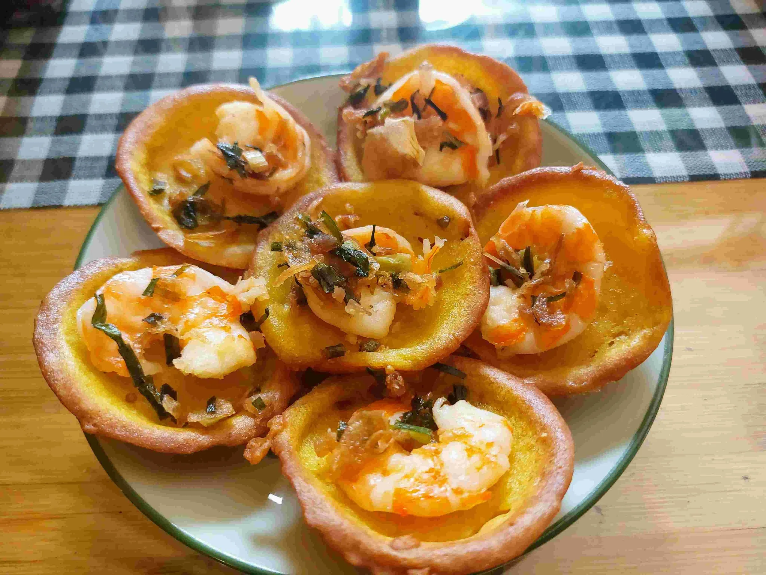 Vietnamese Bánh Khọt – crispy mini savoury rice pancakes topped with shrimp and fresh herbs