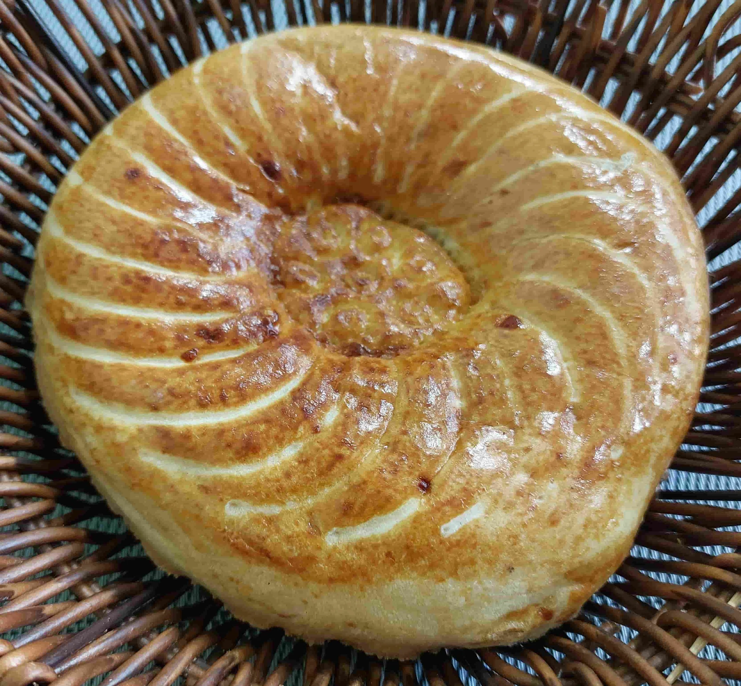 Uzbek Obi Non round traditional flatbread with decorative patterns