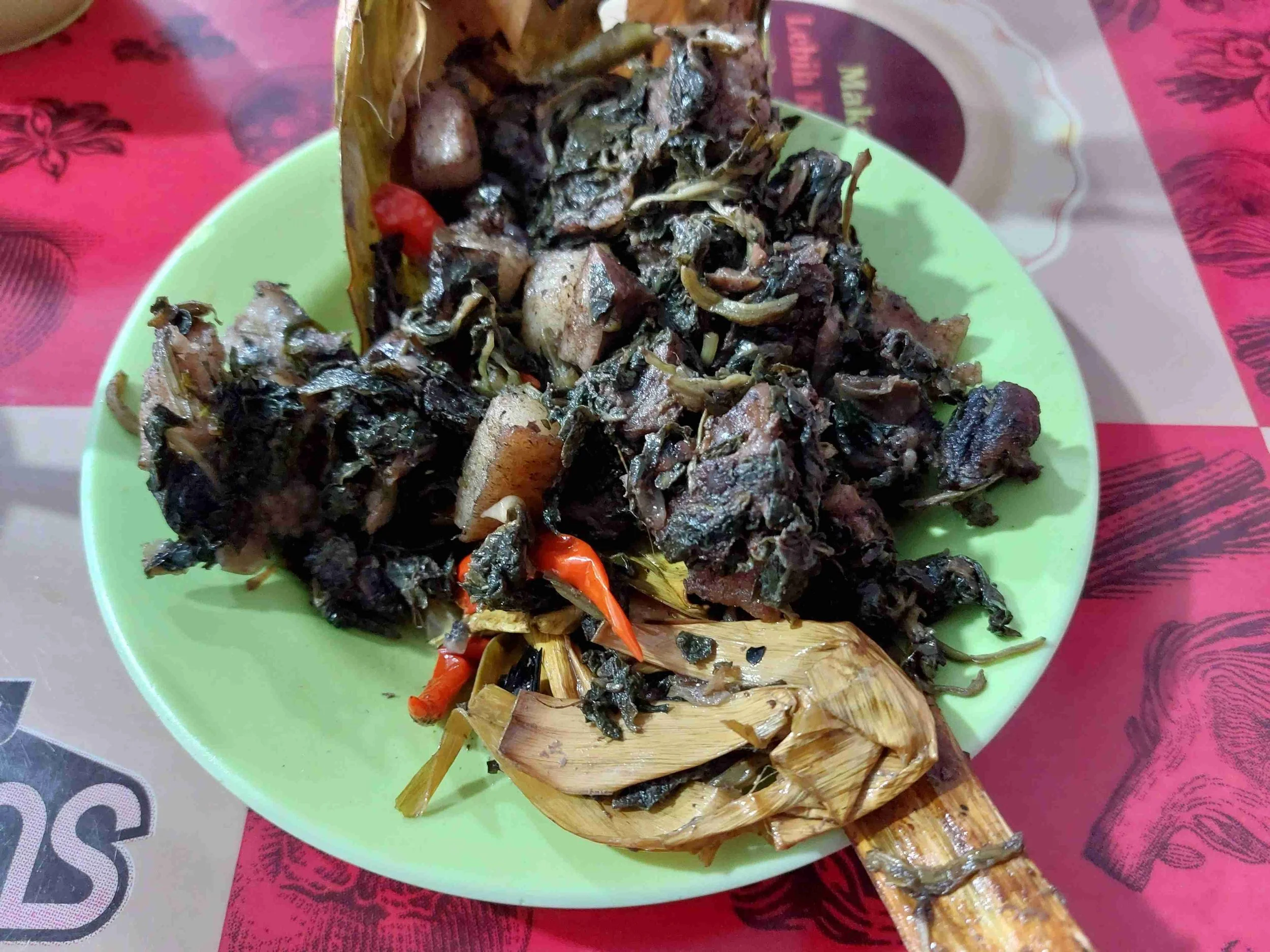 Pa’Piong – traditional Tana Toraja dish of spiced meat and vegetables wrapped in banana leaves and grilled