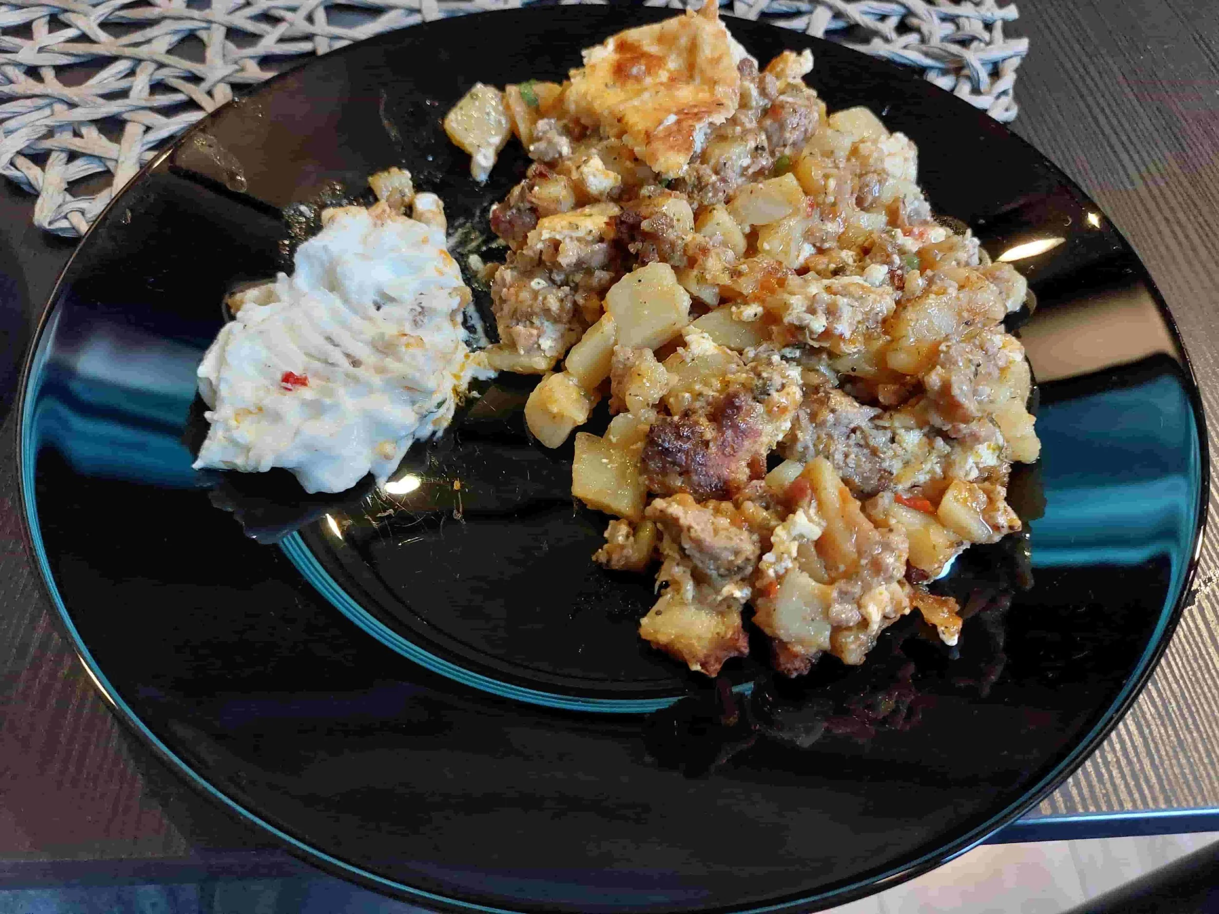 Bulgarian moussaka baked potato and minced meat casserole with sour cream