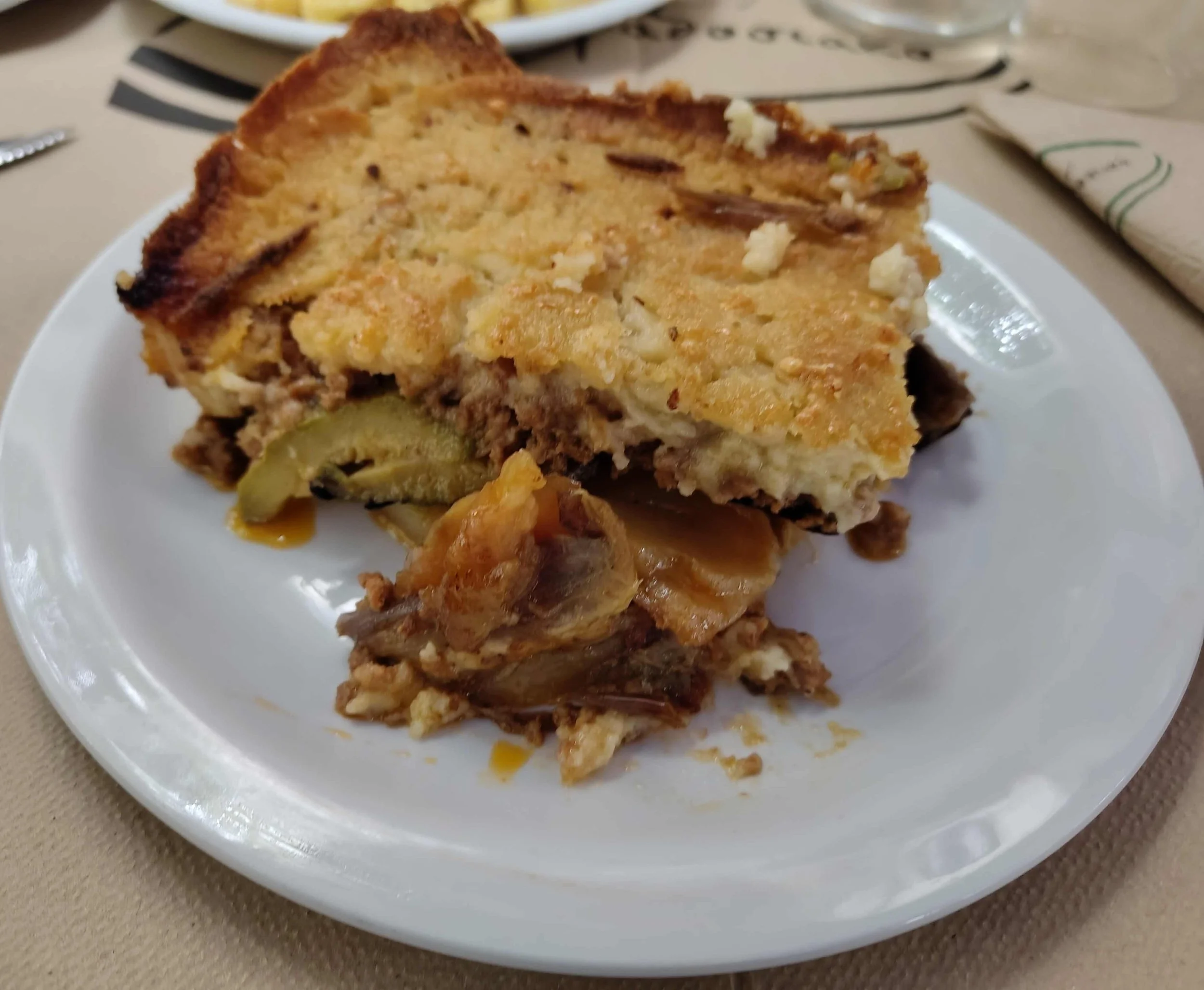Moussaka – traditional Greek baked aubergine, minced meat, and béchamel dish