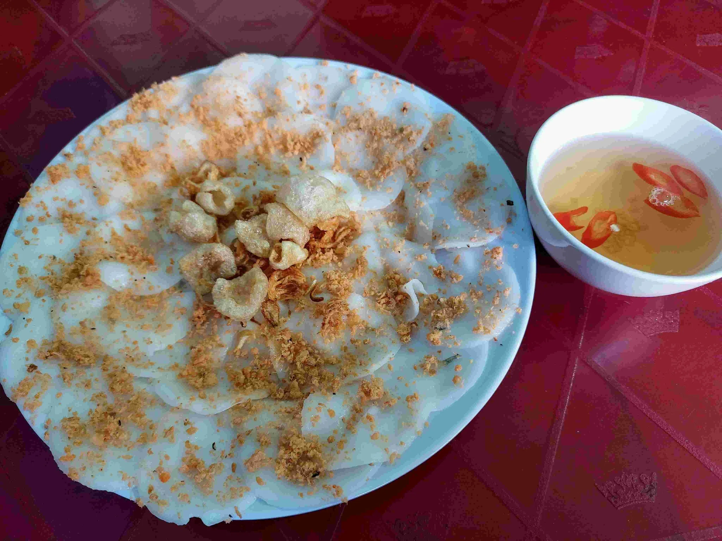 Bánh Bèo – Vietnamese steamed rice cakes topped with shrimp, served with a bowl of nước chấm dipping sauce