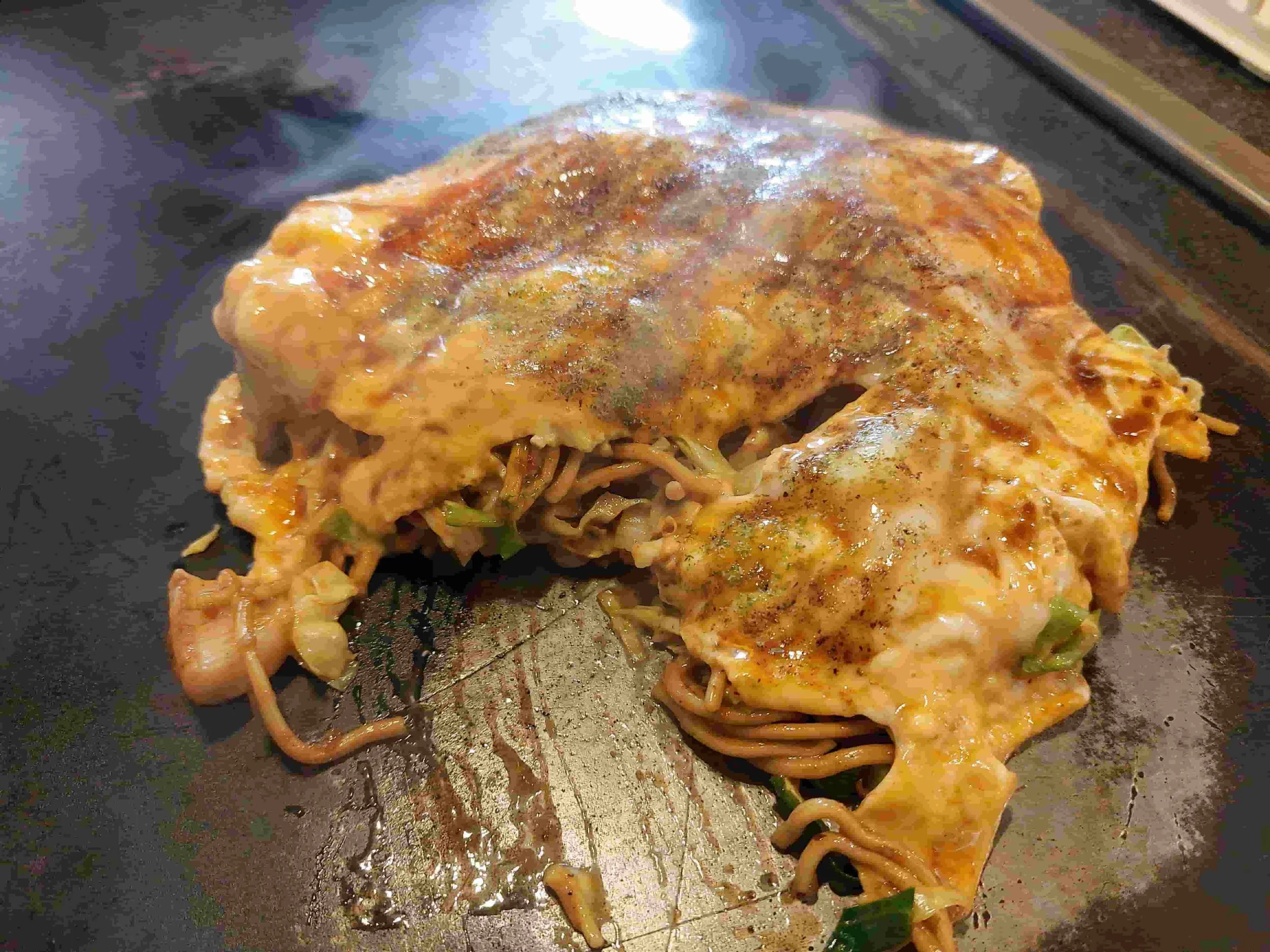 Japanese omusoba – fried yakisoba noodles wrapped in a fluffy omelette