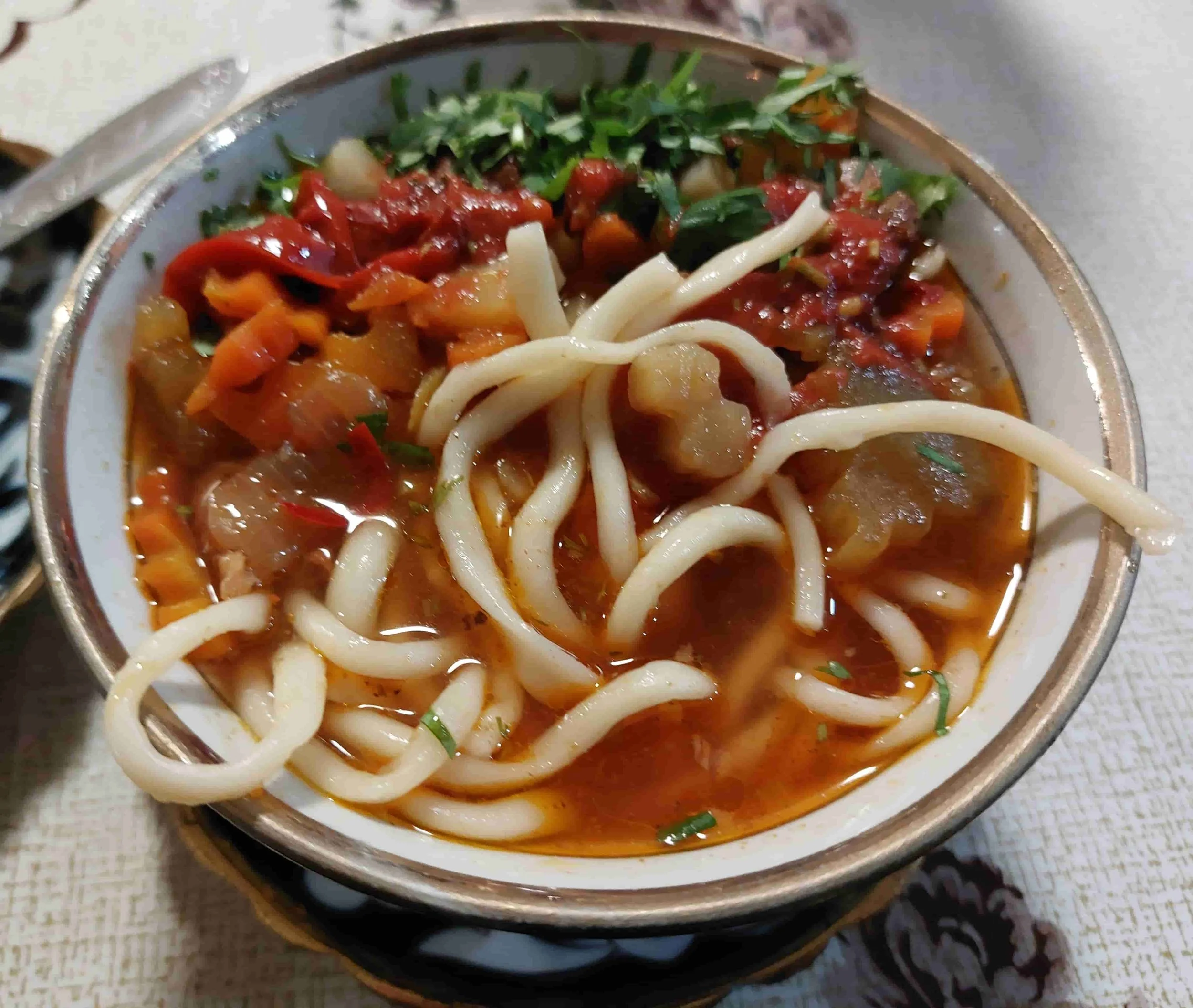 Uzbek Lagman hand-pulled noodles with beef, vegetables, and savory broth