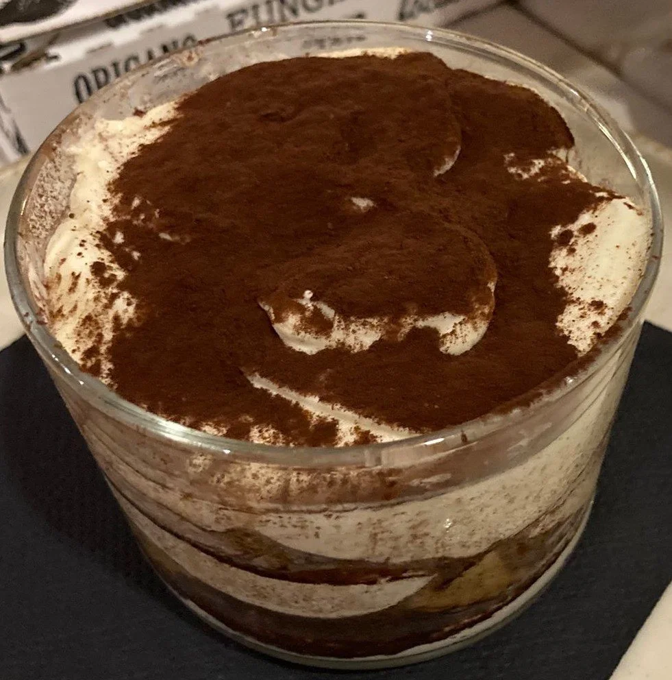 Tiramisu – Italian dessert made with coffee-soaked ladyfingers, mascarpone cream, and cocoa powder
