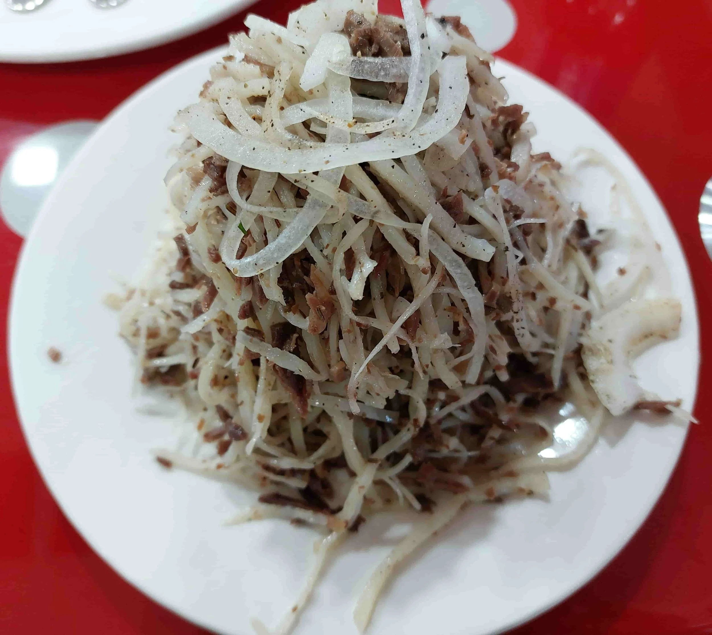 Uzbek Norin hand-pulled noodles served cold with shredded beef and vegetables