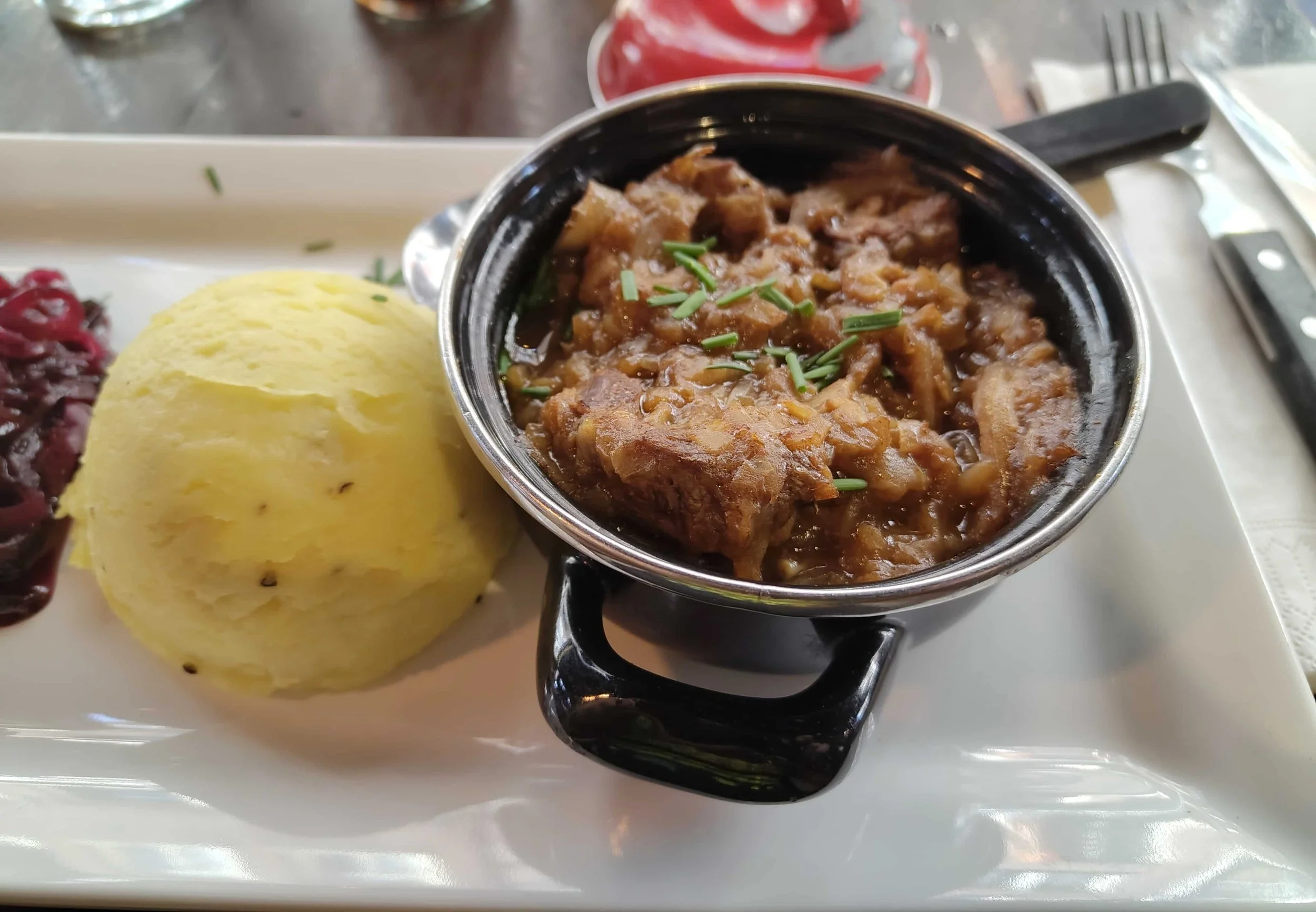 Dutch hachee – slow-cooked beef and onion stew served with creamy mashed potatoes