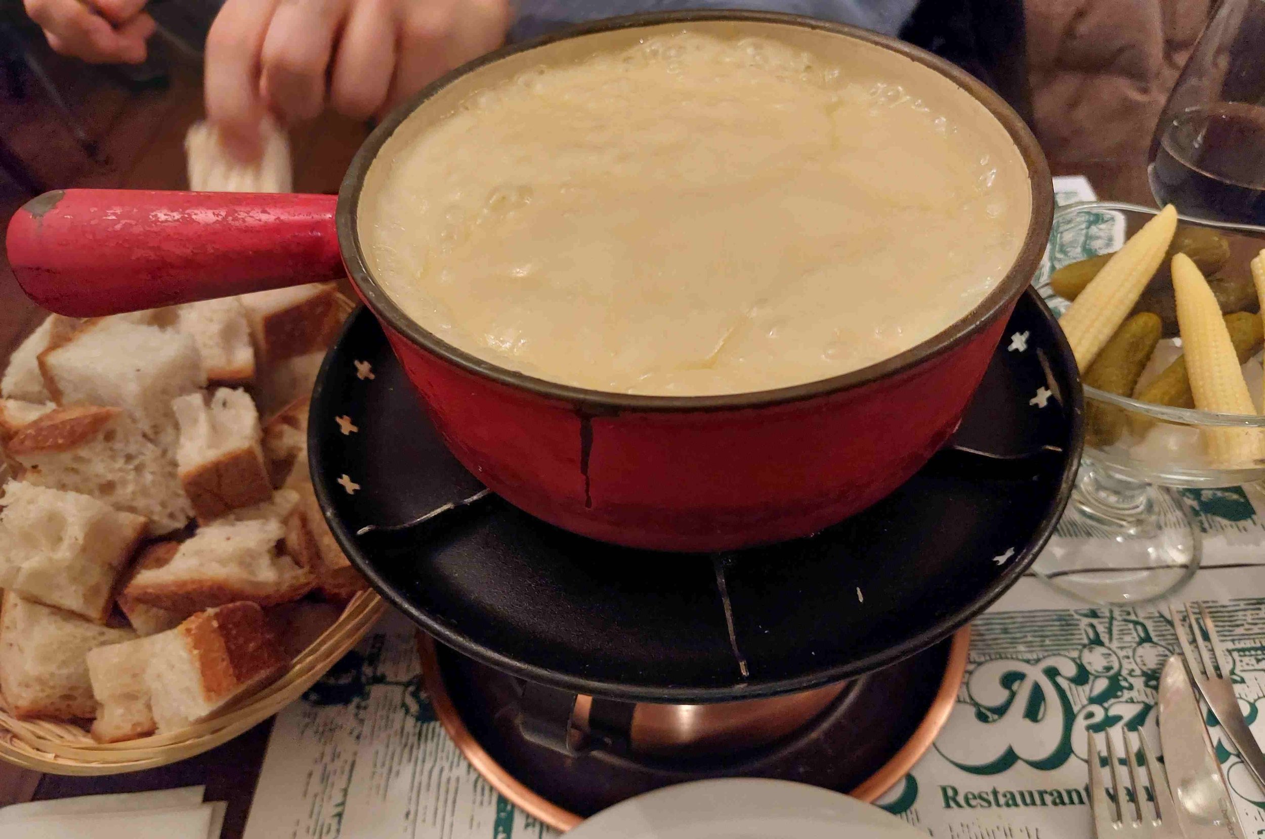 Fondue – Swiss melted cheese served with bread for dipping